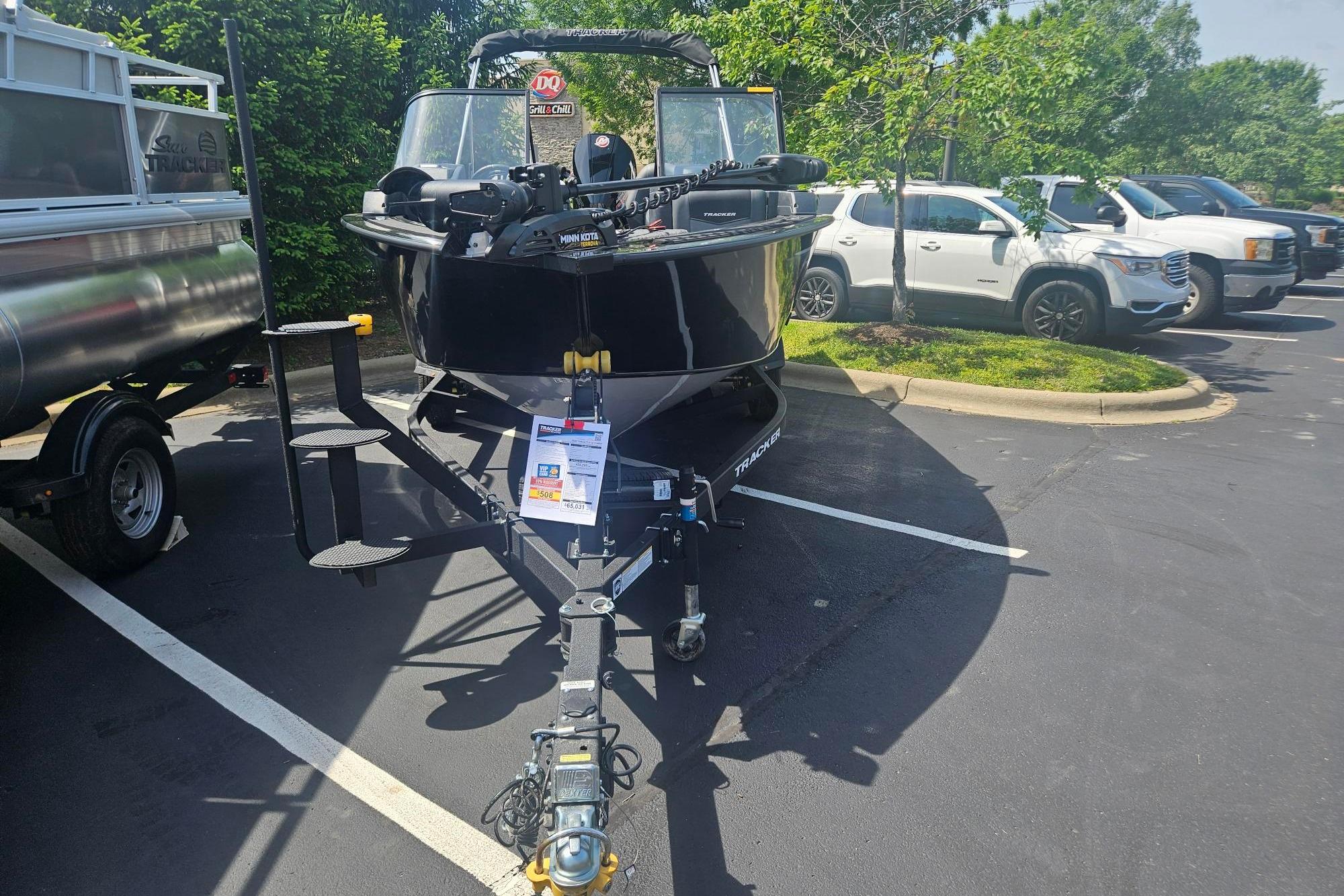 2026 Tracker Targa V-19 Combo boat on trailer in parking lot.