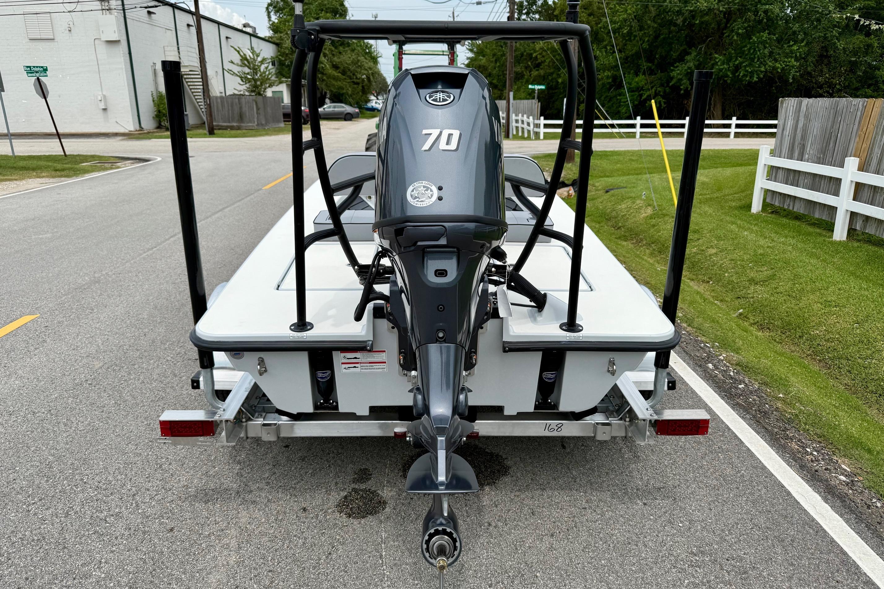 2026 Maverick 17 HPX-S boat on trailer, rear view with 70 HP engine.