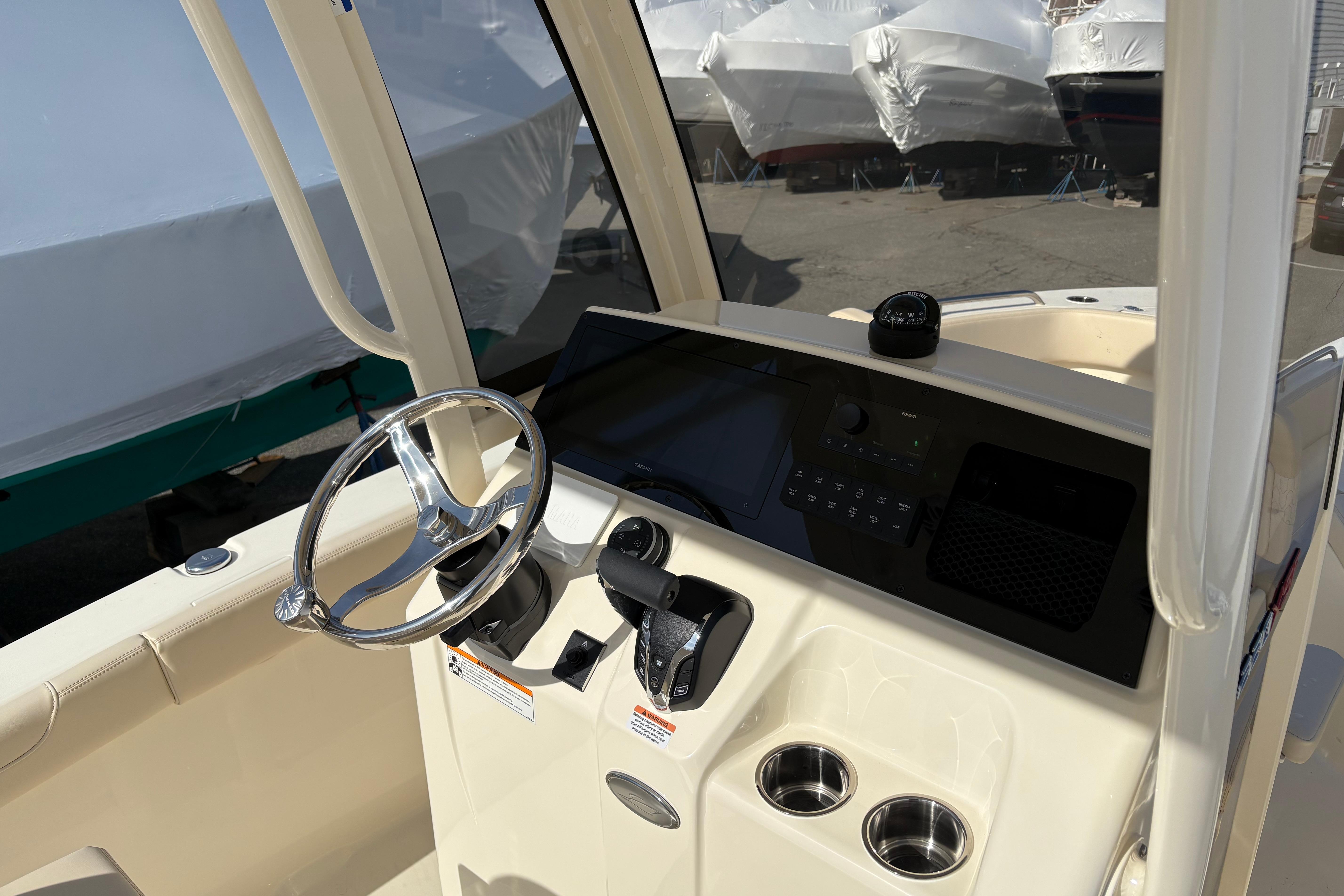 2026 Scout 220 XSF boat dashboard with steering wheel and controls.