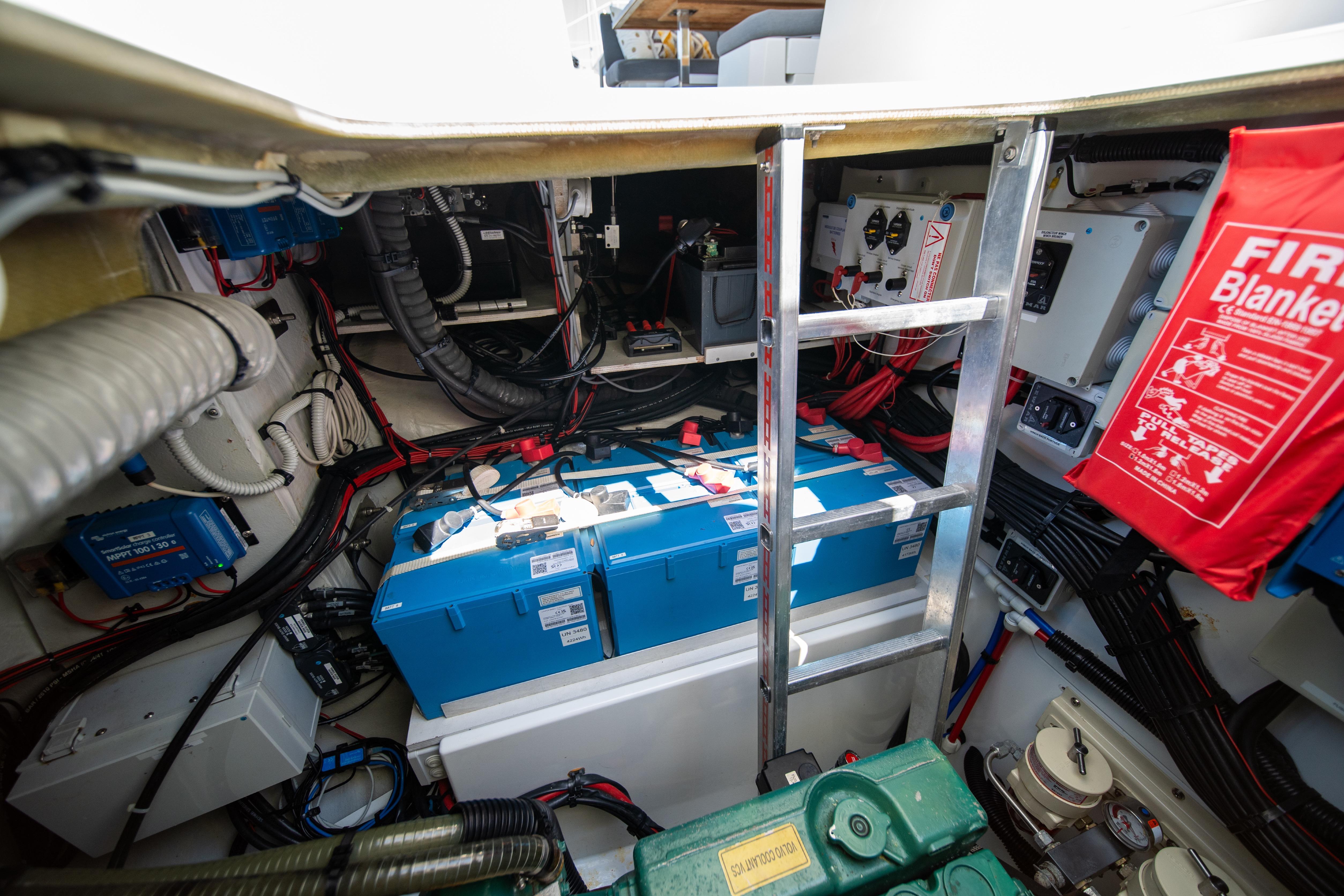 Engine room of 2022 Fountaine Pajot Aura 51 Catamaran with batteries and equipment.
