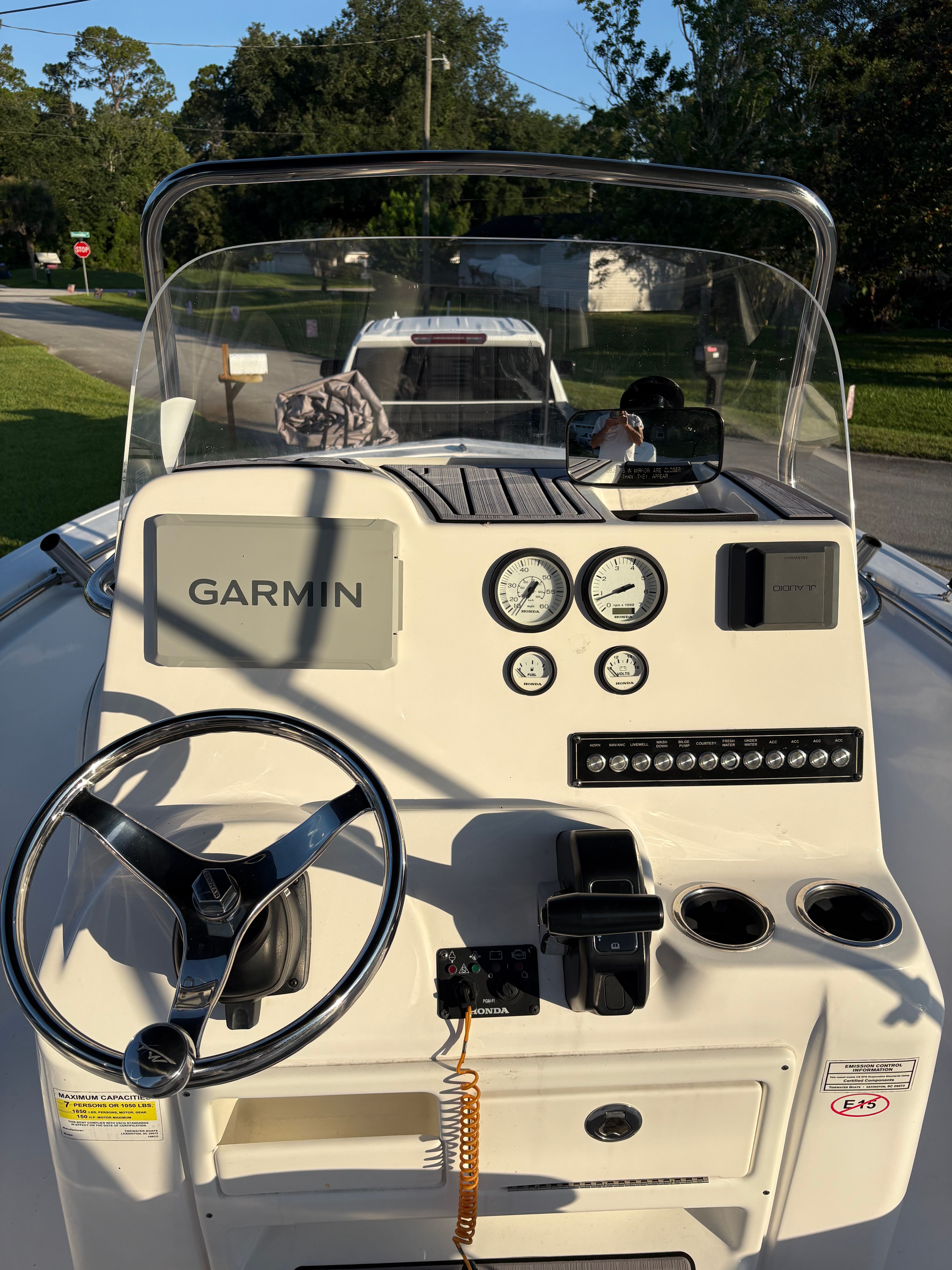 The dashboard of a 2024 Tidewater 198 CC Adventure boat with Garmin navigation.
