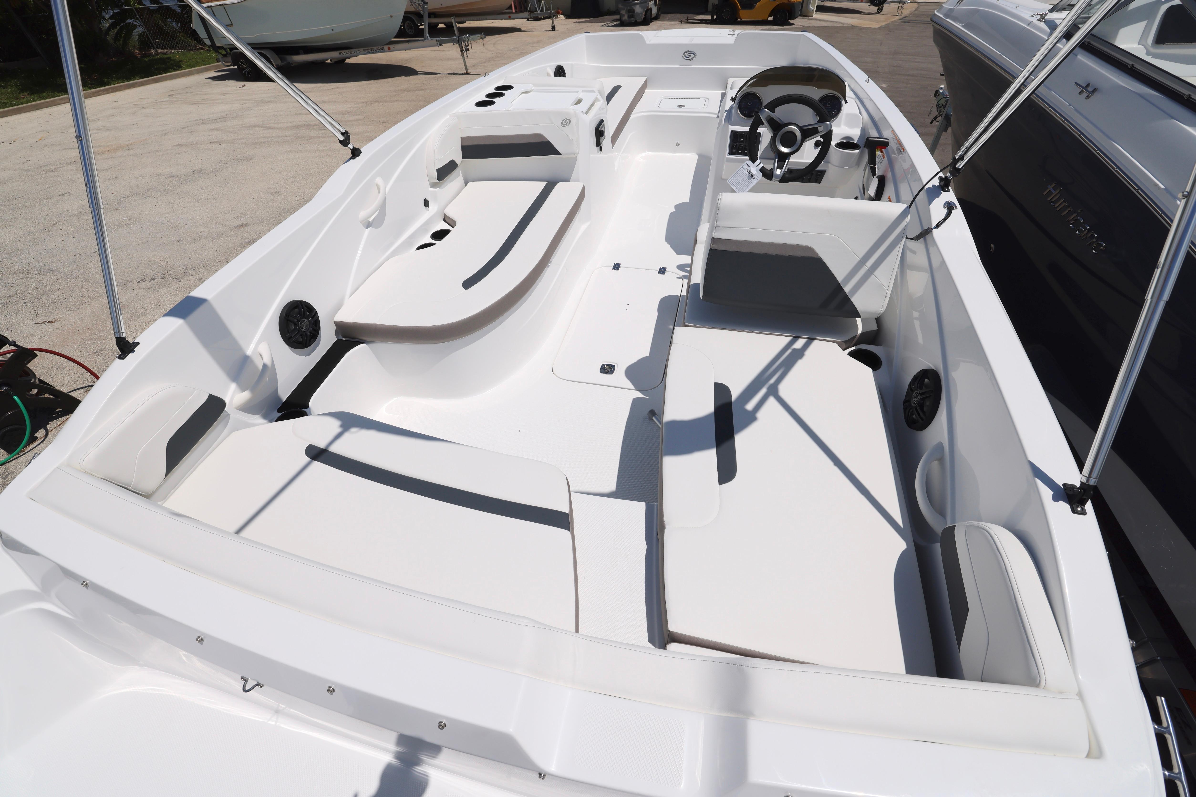 2026 Hurricane SunDeck Sport 205 OB boat interior with spacious seating and modern steering console.