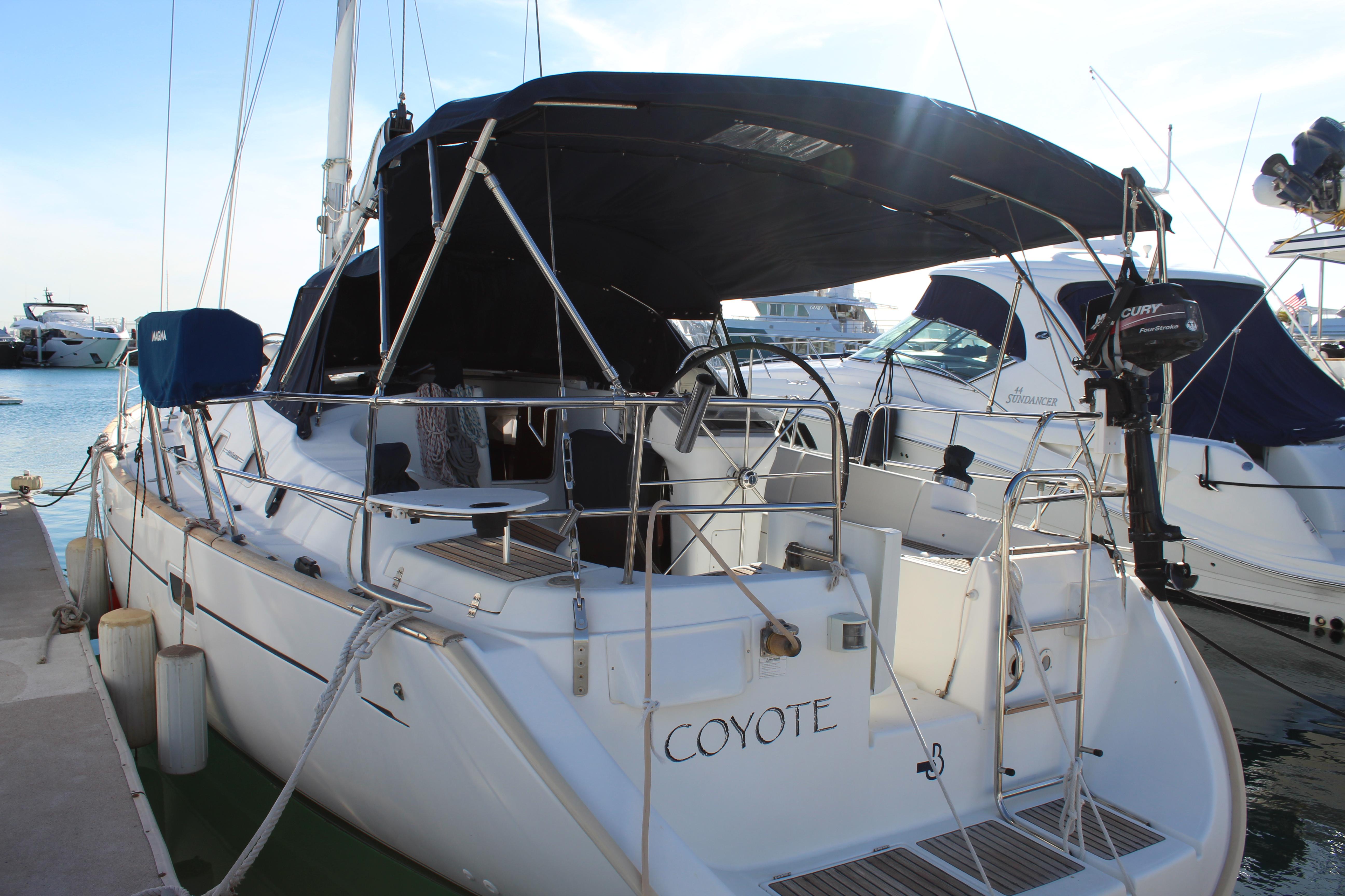 2004 Beneteau Oceanis Clipper 423 sailboat docked at marina.