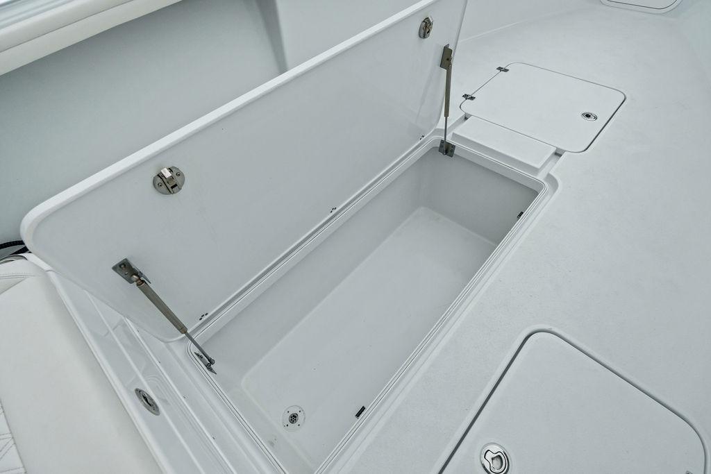 2021 Yellowfin 36 Offshore boat storage compartment, open lid, spacious interior.
