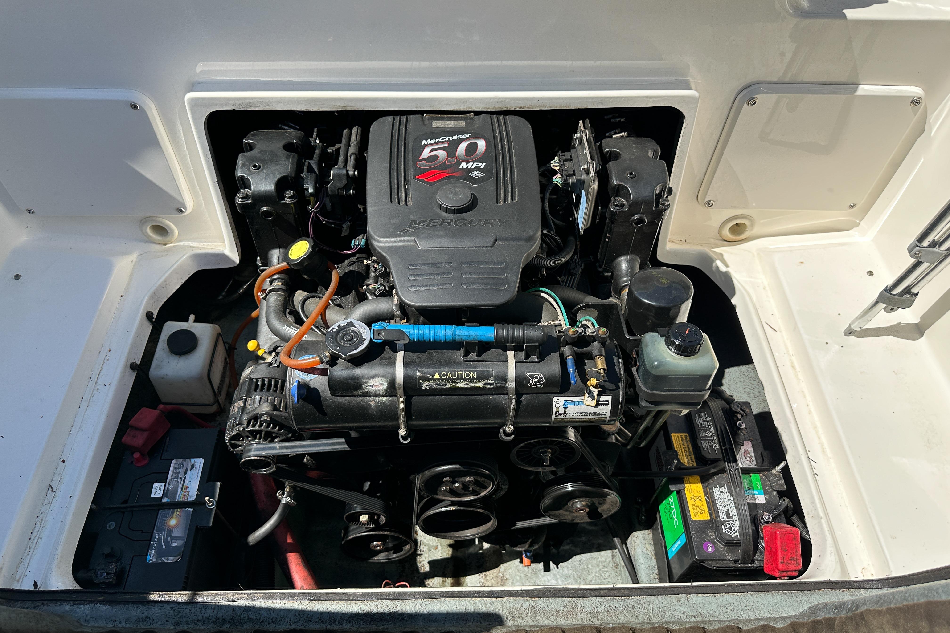 Engine compartment of a 1998 Sea Ray 215 Express Cruiser with MerCruiser 5.0 MPI engine.