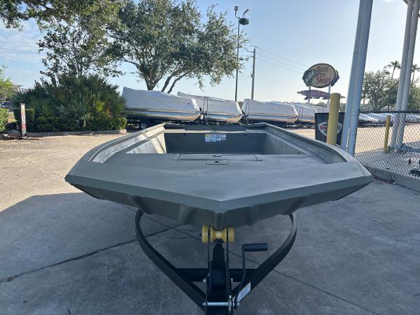 2025 Tracker GRIZZLY 1860 Utility boat on trailer in outdoor setting.