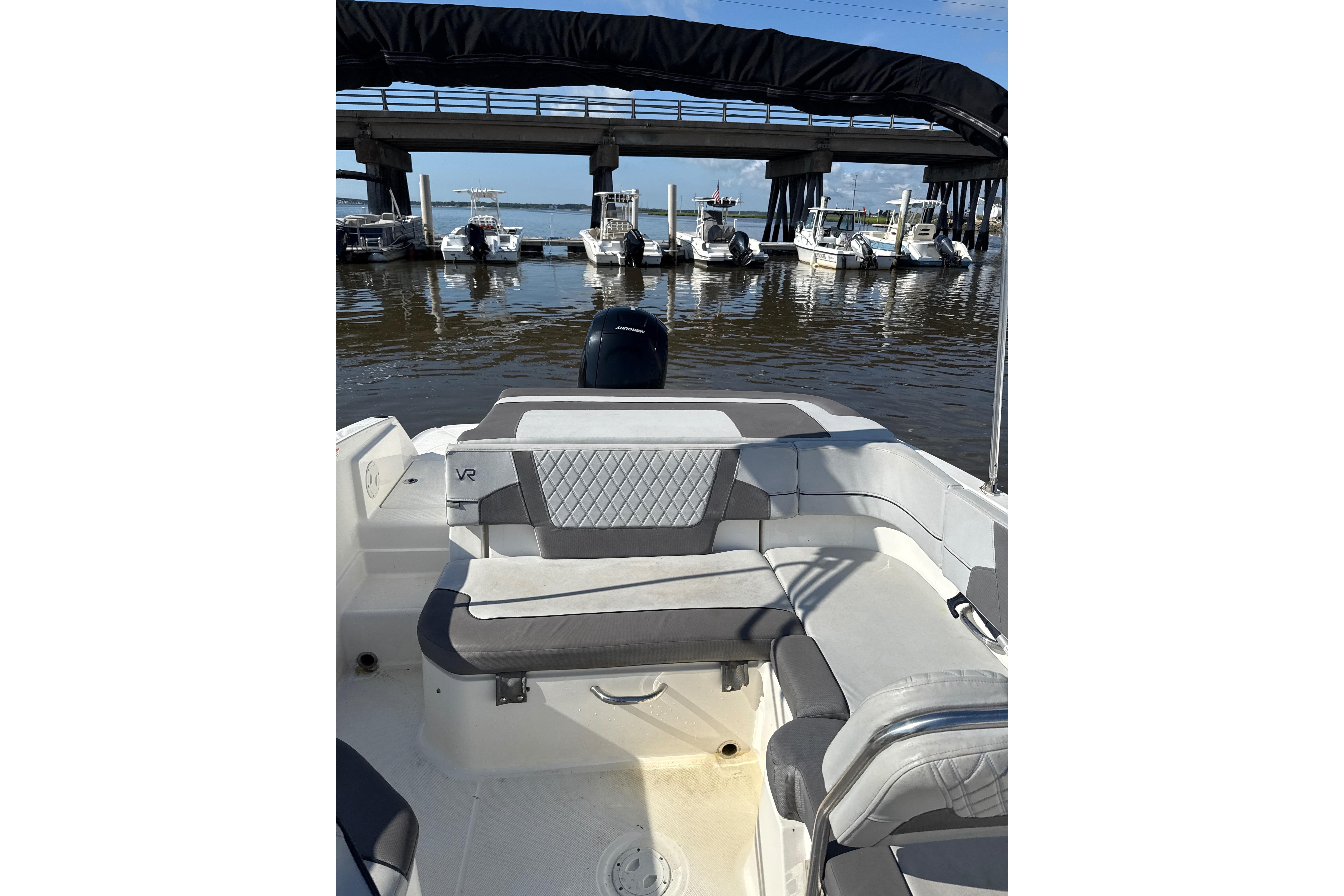 2023 Bayliner VR6 Bowrider OB interior with marina view in the background.