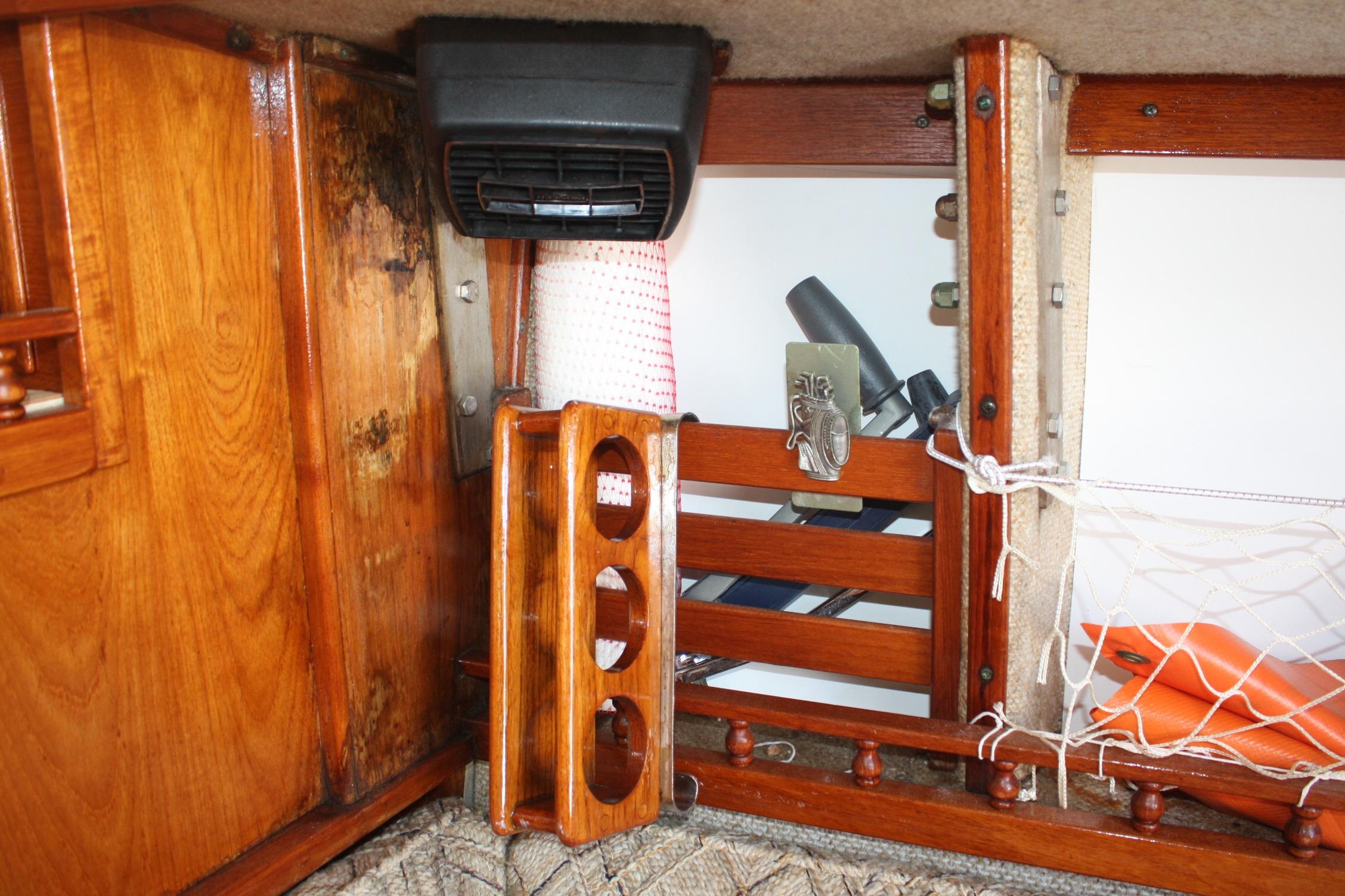 Interior of 1981 S2 9.2A sailboat with wooden cabinetry and storage compartments.