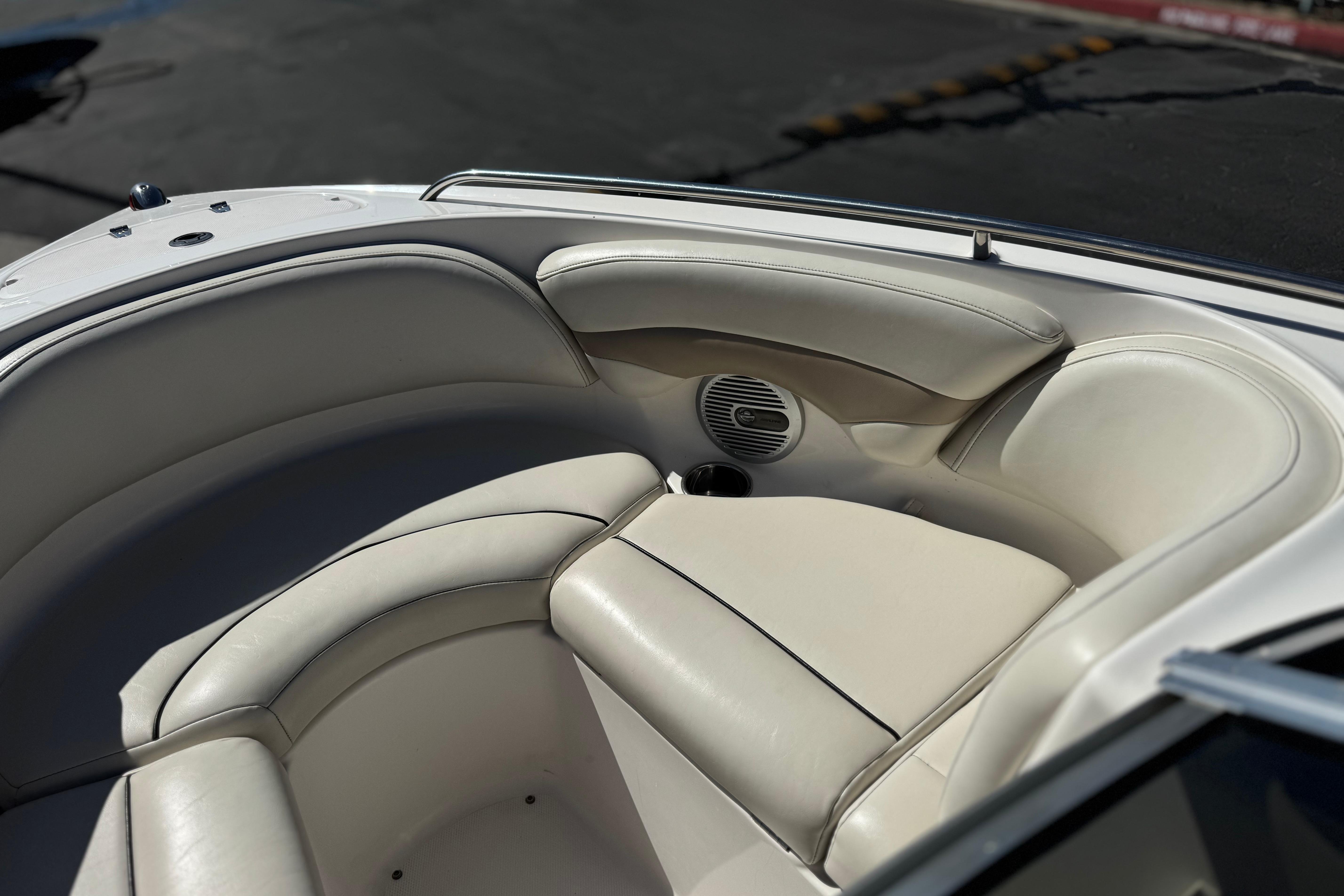 Interior seating of a 2002 Chaparral 186 SSi boat, featuring white cushioned seats.