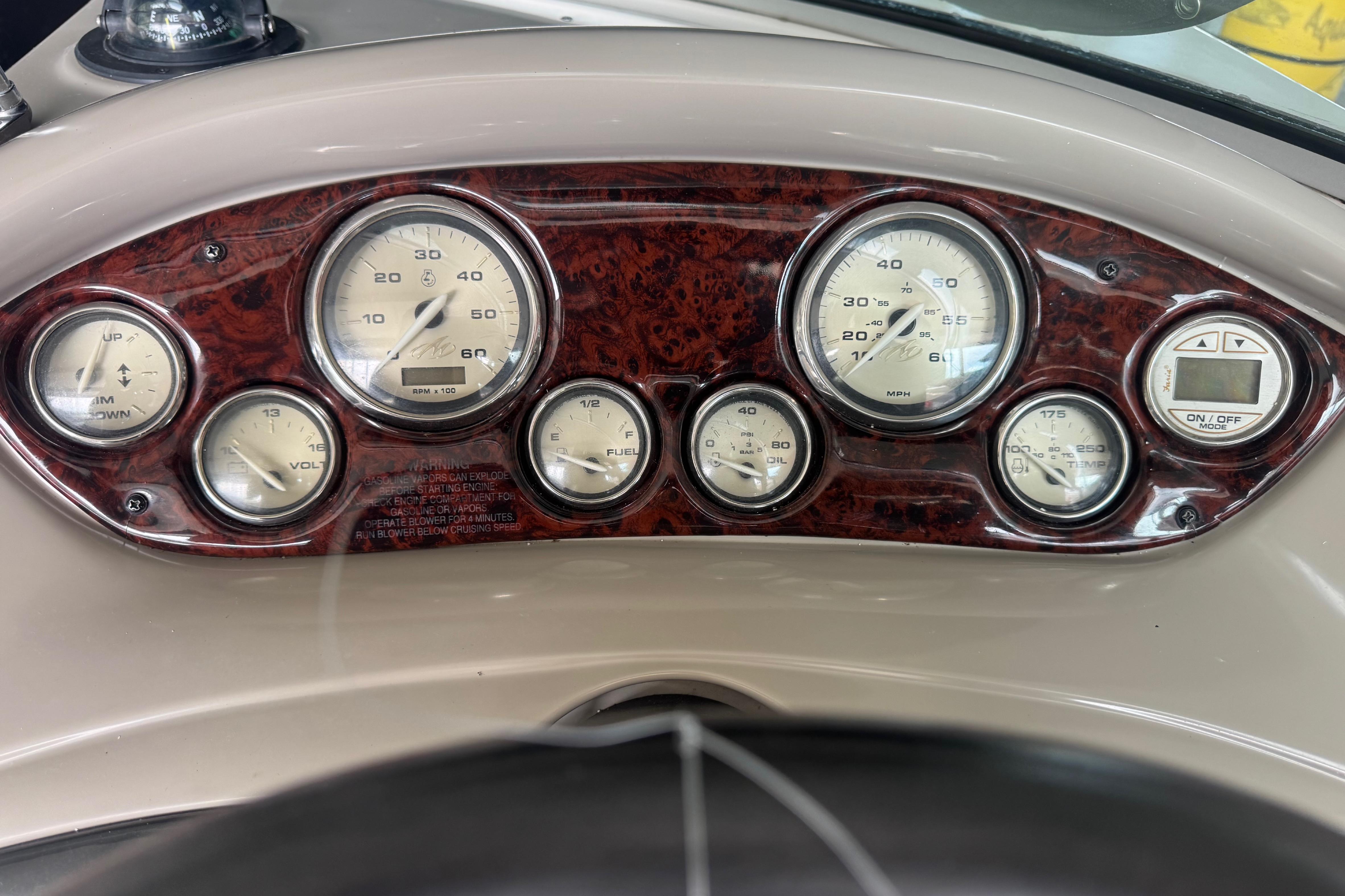 Dashboard of a 2005 Monterey 248LS Montura Bowrider with gauges and controls.