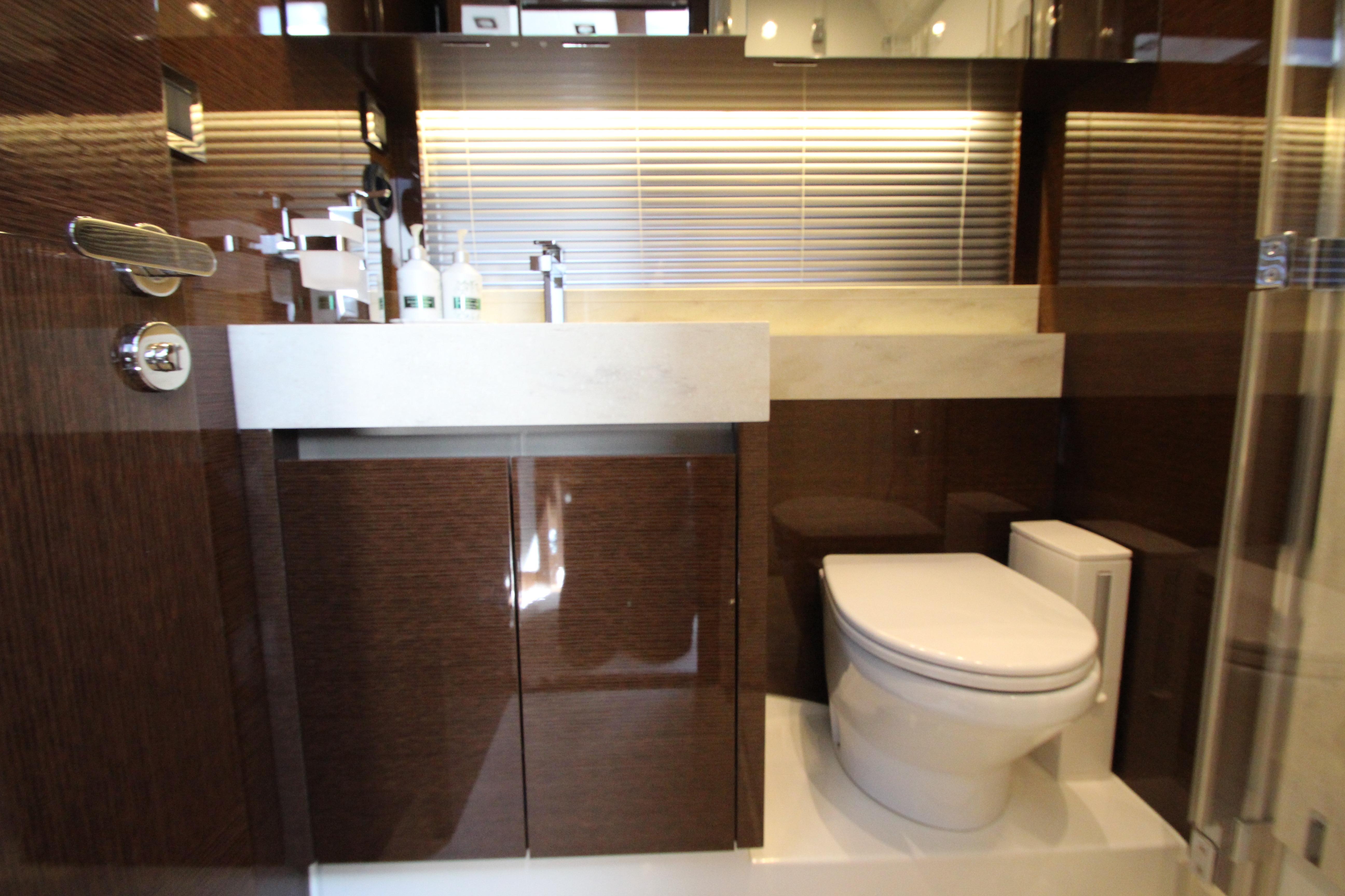 Luxurious bathroom interior on a 2022 Prestige 520 yacht, featuring modern fixtures and elegant design.