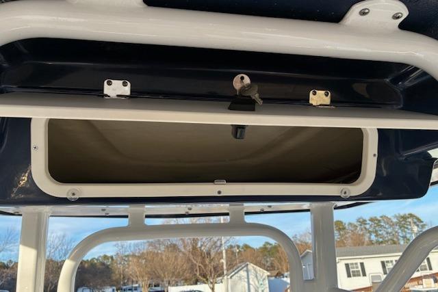 Open storage compartment on a 2026 Robalo 226 Cayman boat.