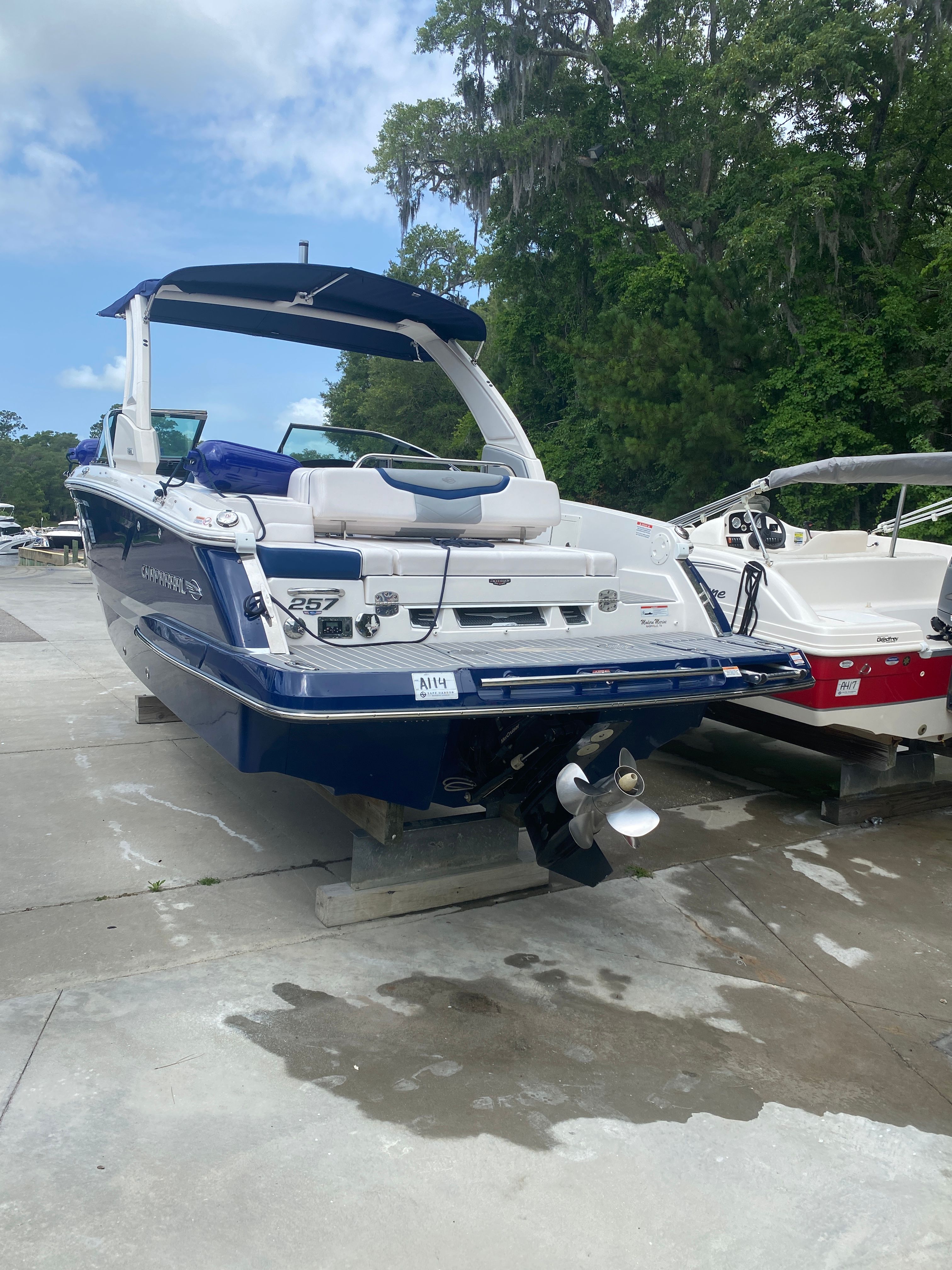 2020 Chaparral 256 SSX boat on a concrete lot.