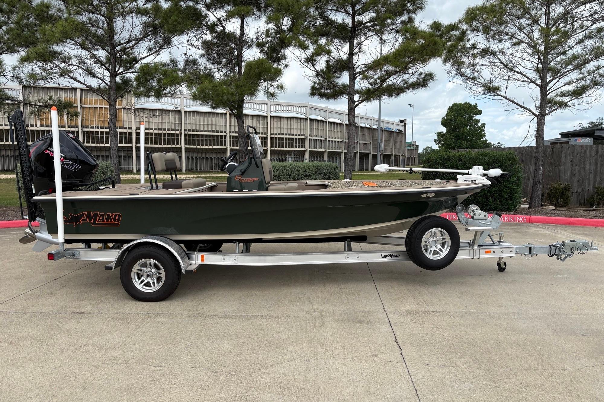 2025 Mako 18 Pro Skiff Backwater Edition on trailer, parked outdoors.