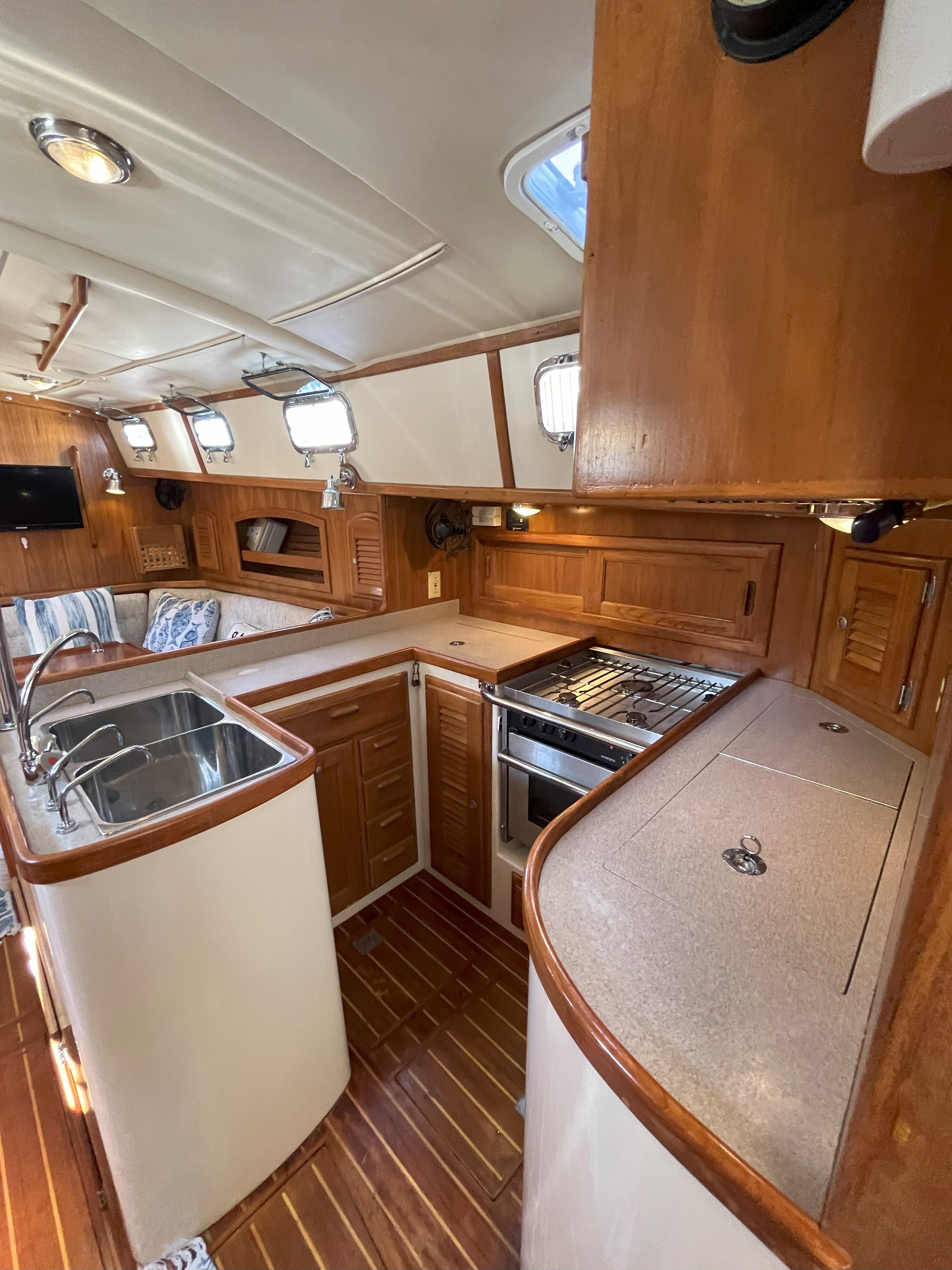 Interior of a 1998 Pacific Seacraft 40 yacht with wooden cabinetry.