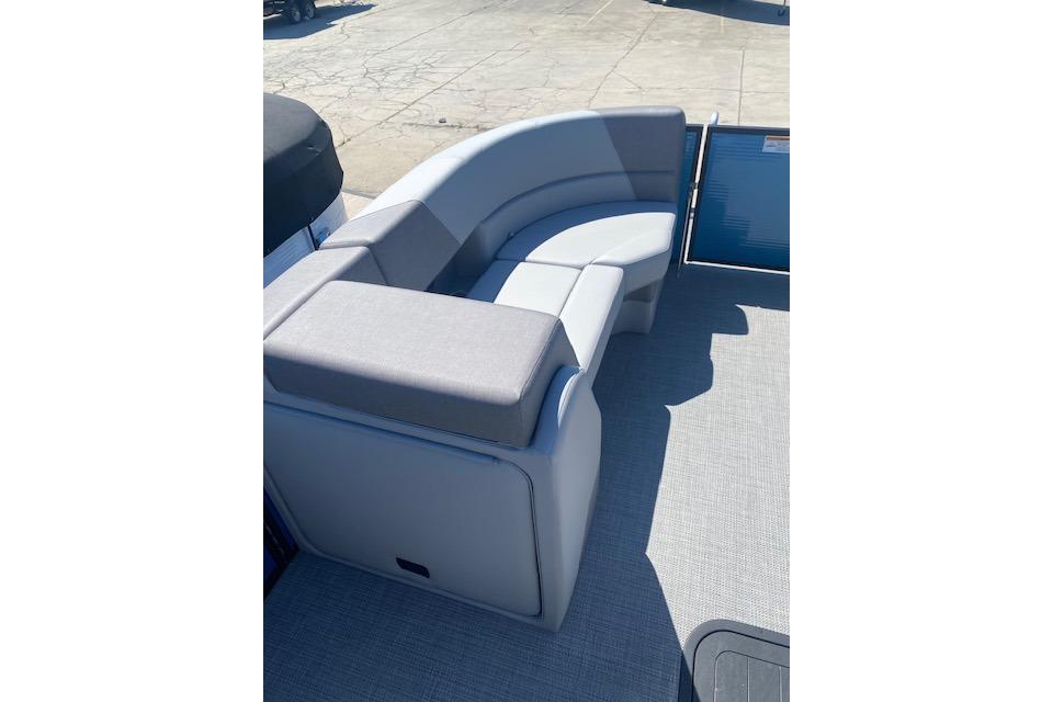 Luxurious seating on 2026 Manitou 23 AURORA RF VPII 575 pontoon boat.