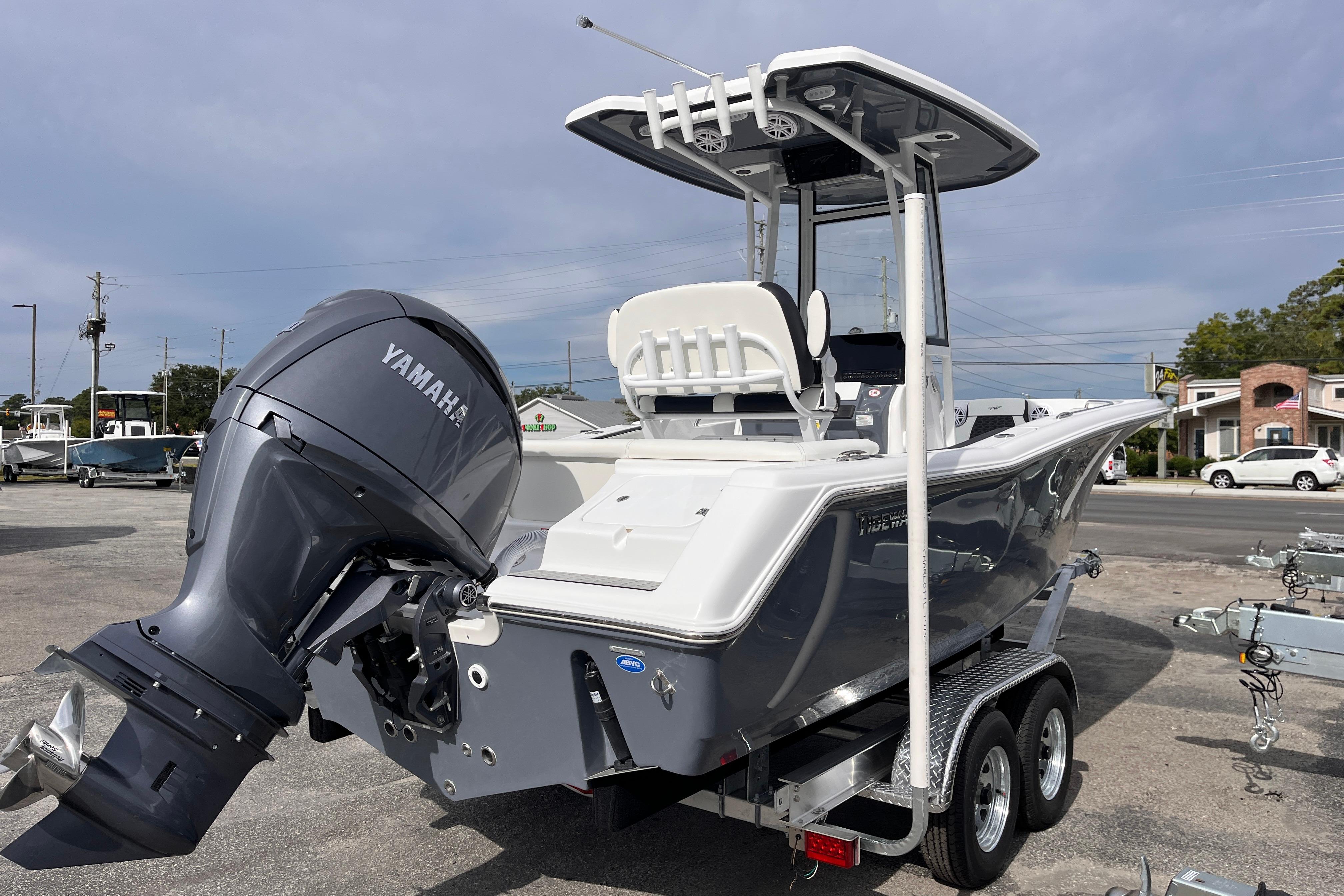 2026 Tidewater 220 LXF boat with Yamaha engine on a trailer, parked outdoors.