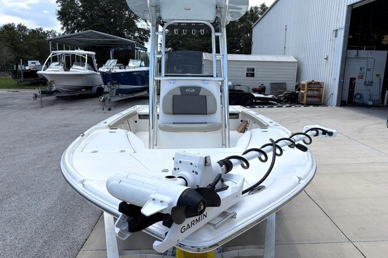 2025 Key West 210 Bay Reef boat with Garmin equipment, parked outdoors near other boats.