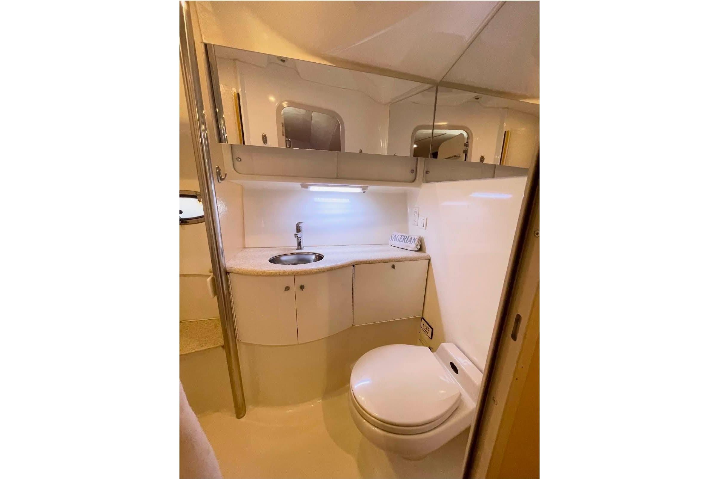 Bathroom interior of a 2003 Formula 40 Performance Cruiser, featuring sink and toilet.