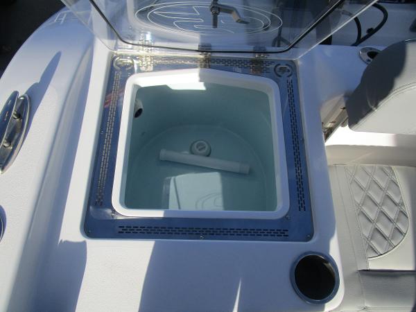 2024 Sea Pro 322 Offshore livewell with open lid and seating area.