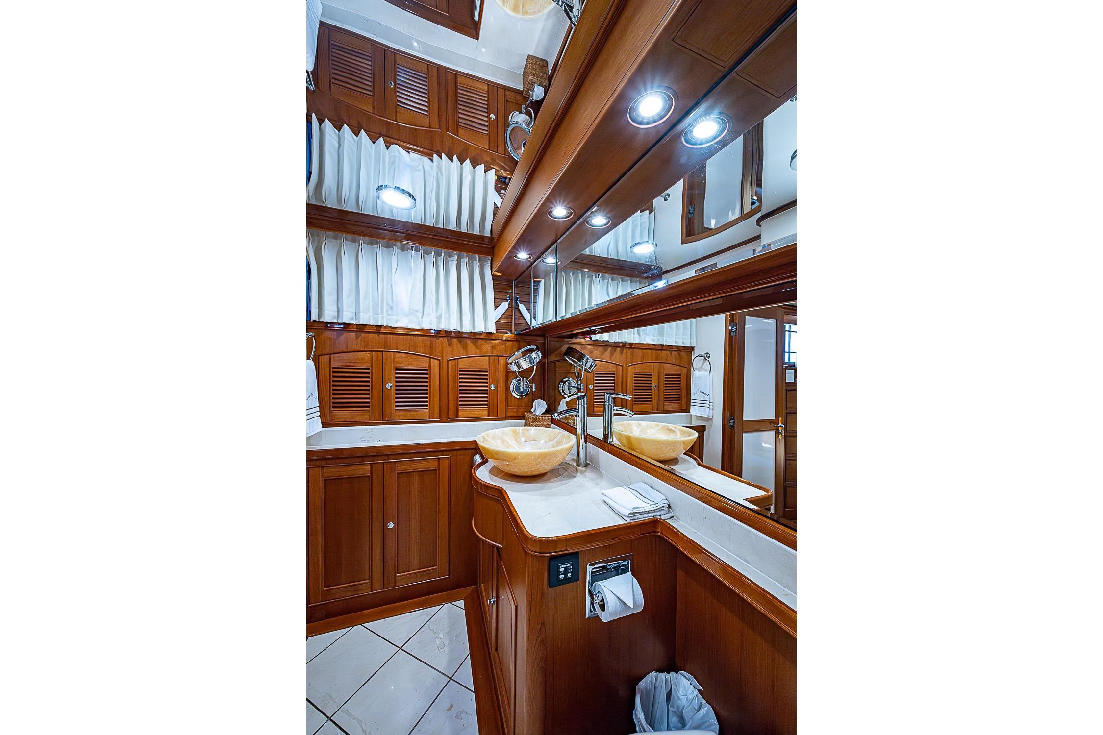 Luxurious wooden bathroom interior on 2014 Marlow 80 Explorer yacht.