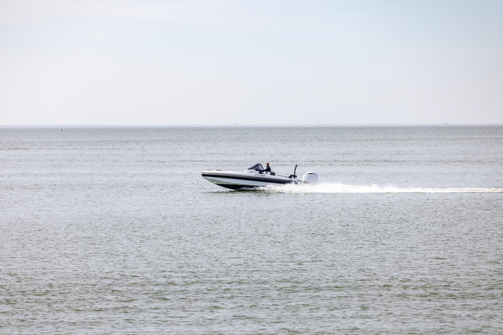 Speedboat Iron 707 cruising on open water, 2022 model.