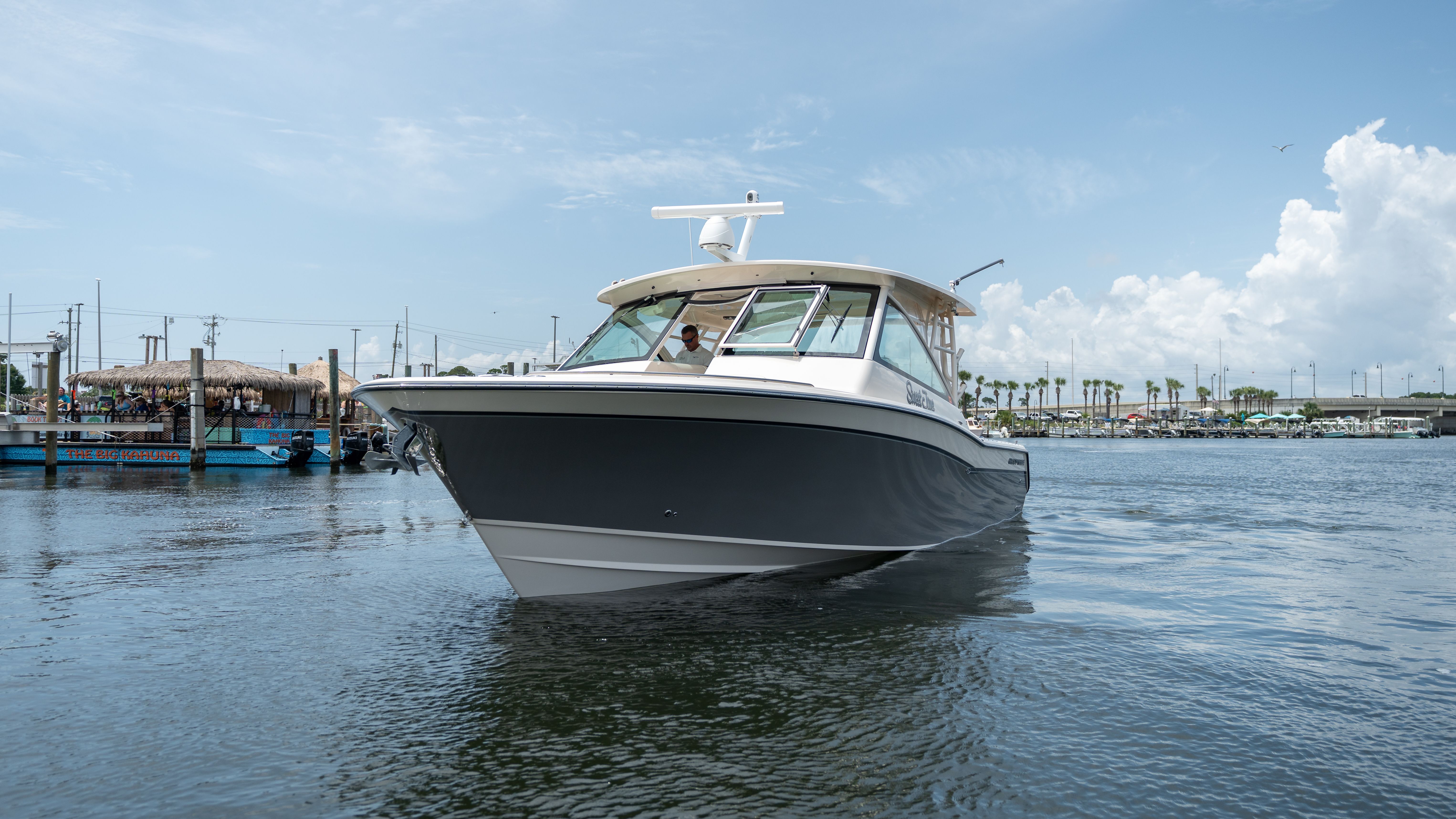 2019 Grady-White 375 Freedom on calm water in a harbor.