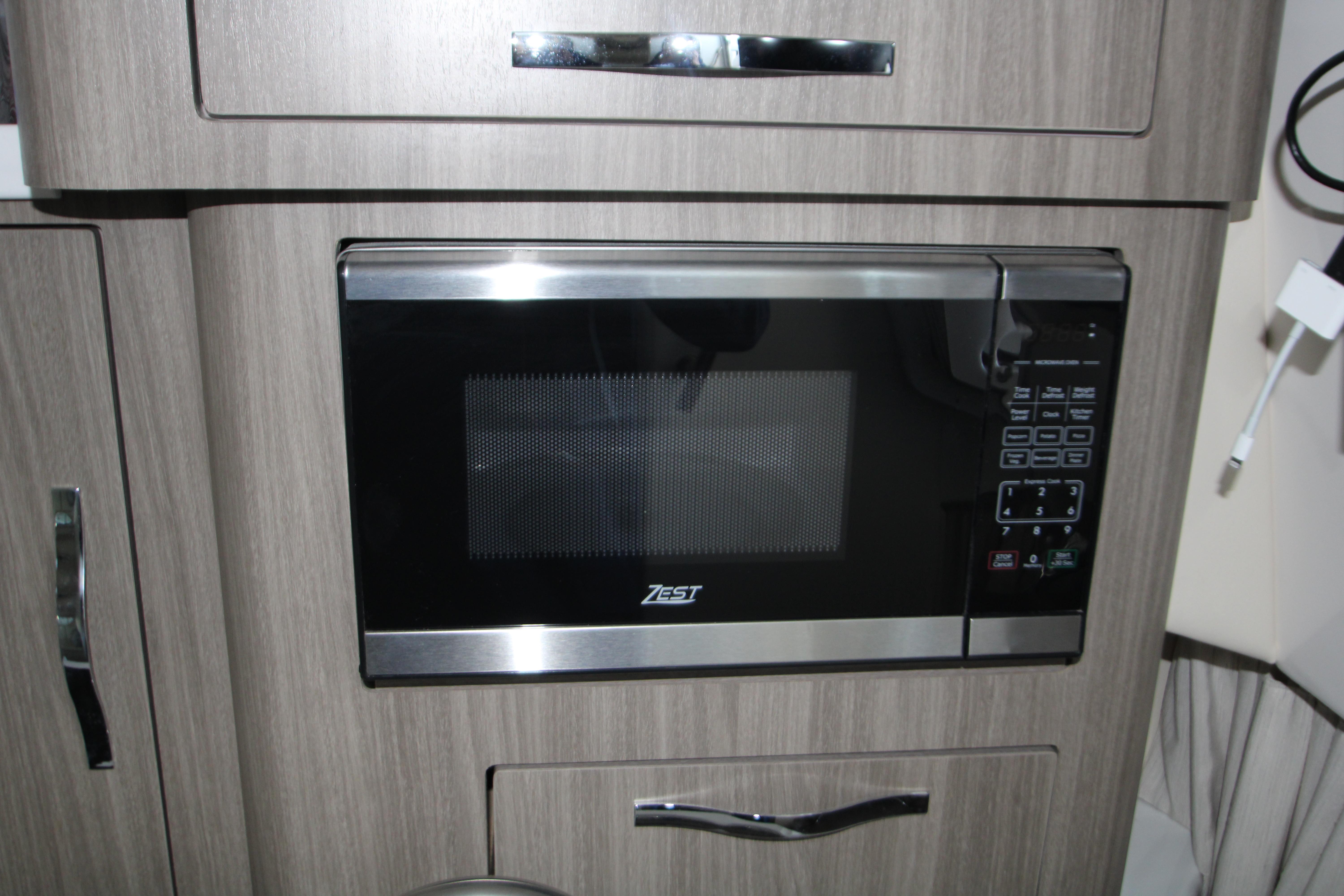 Microwave in 2022 Regal 28 Express boat kitchen interior.