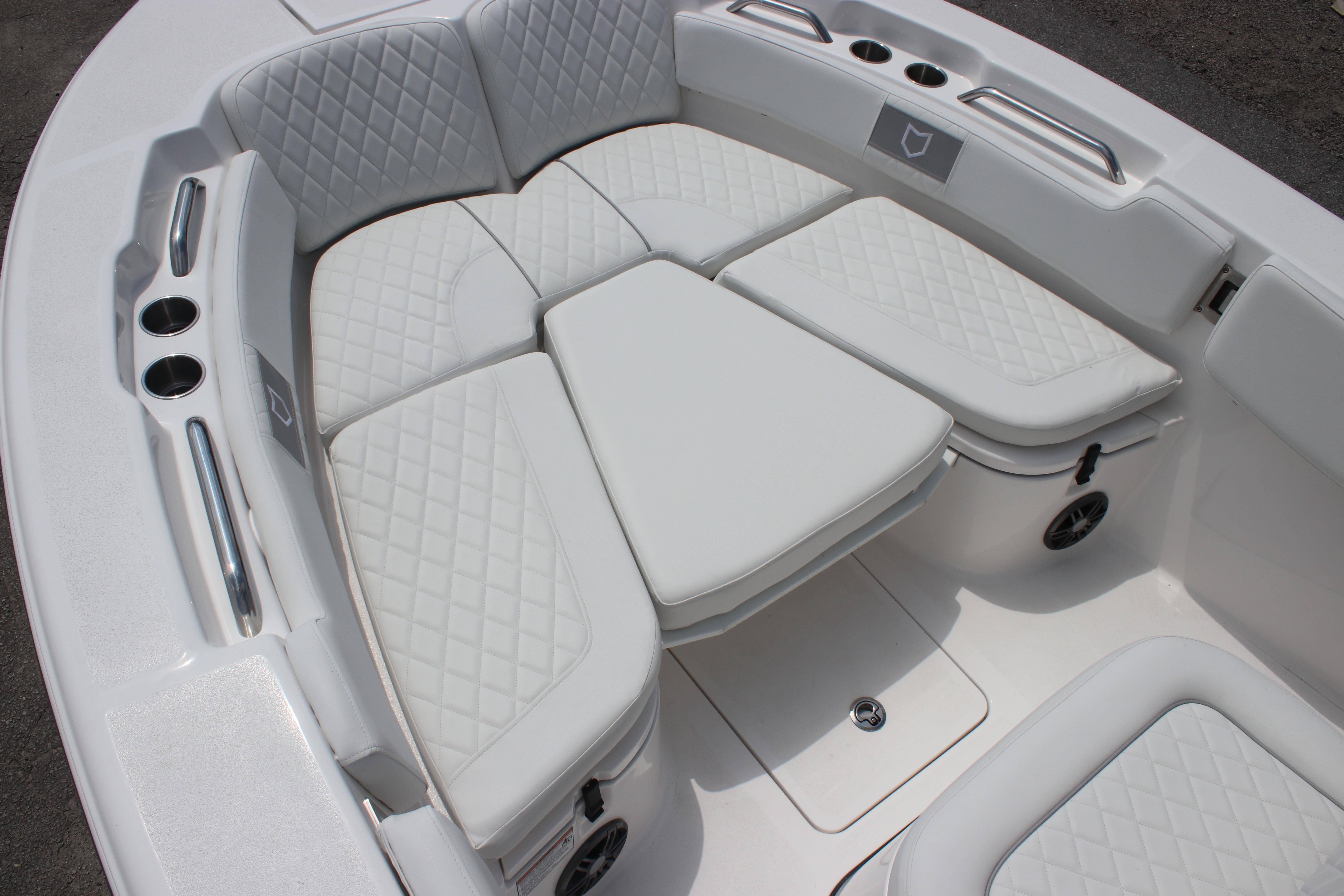 Luxurious seating on 2026 Sea Fox 248 Commander boat with quilted white upholstery.