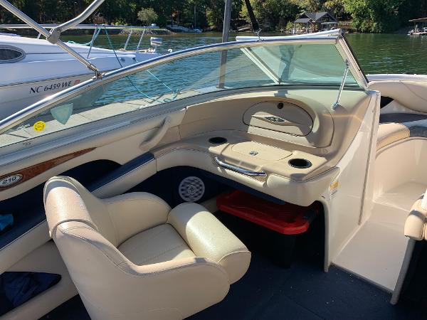 Interior of a 2000 Sea Ray 210 Bow Rider boat with beige seating.