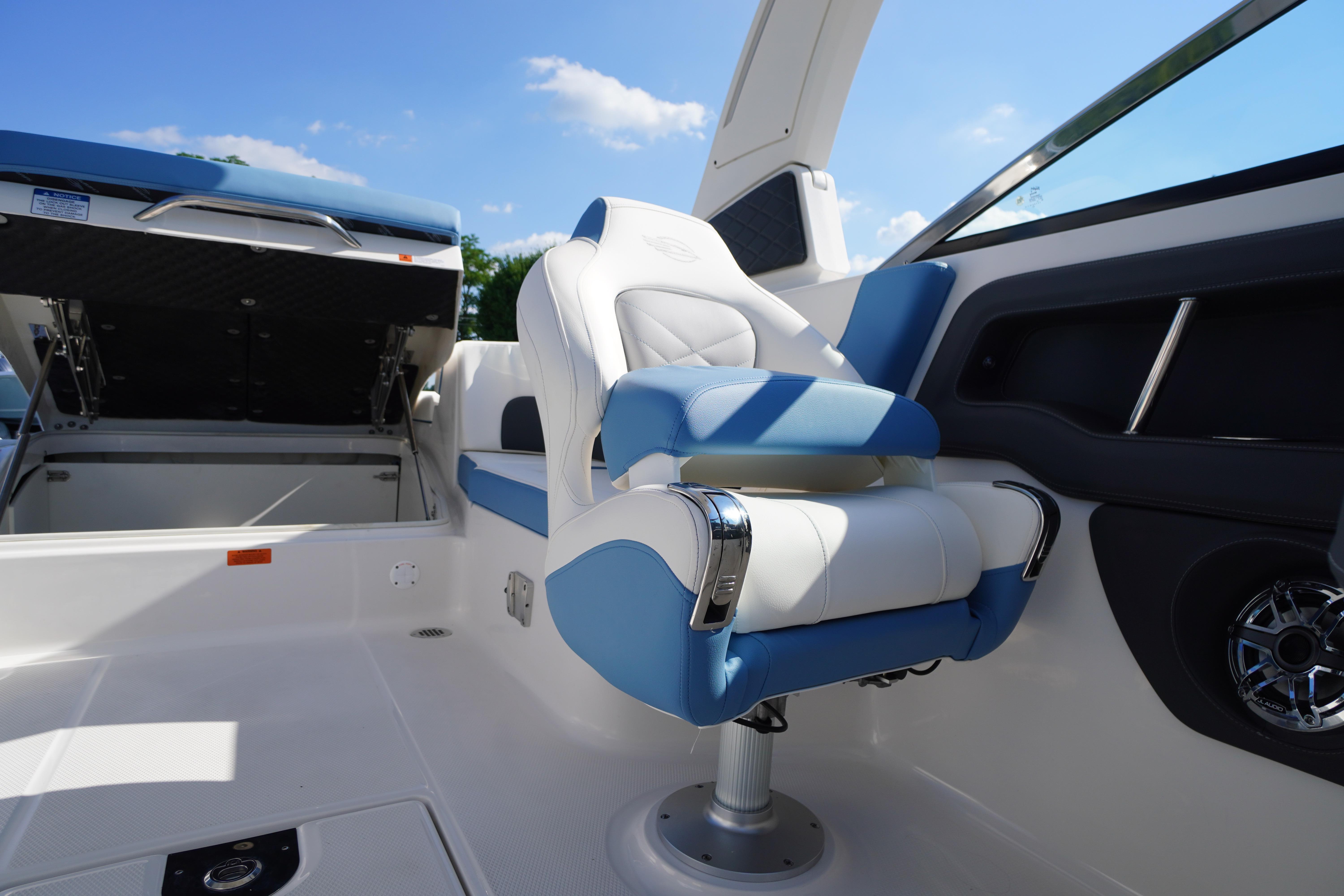 Luxury seating on 2026 Chaparral 270 OSX boat, featuring blue and white upholstery.