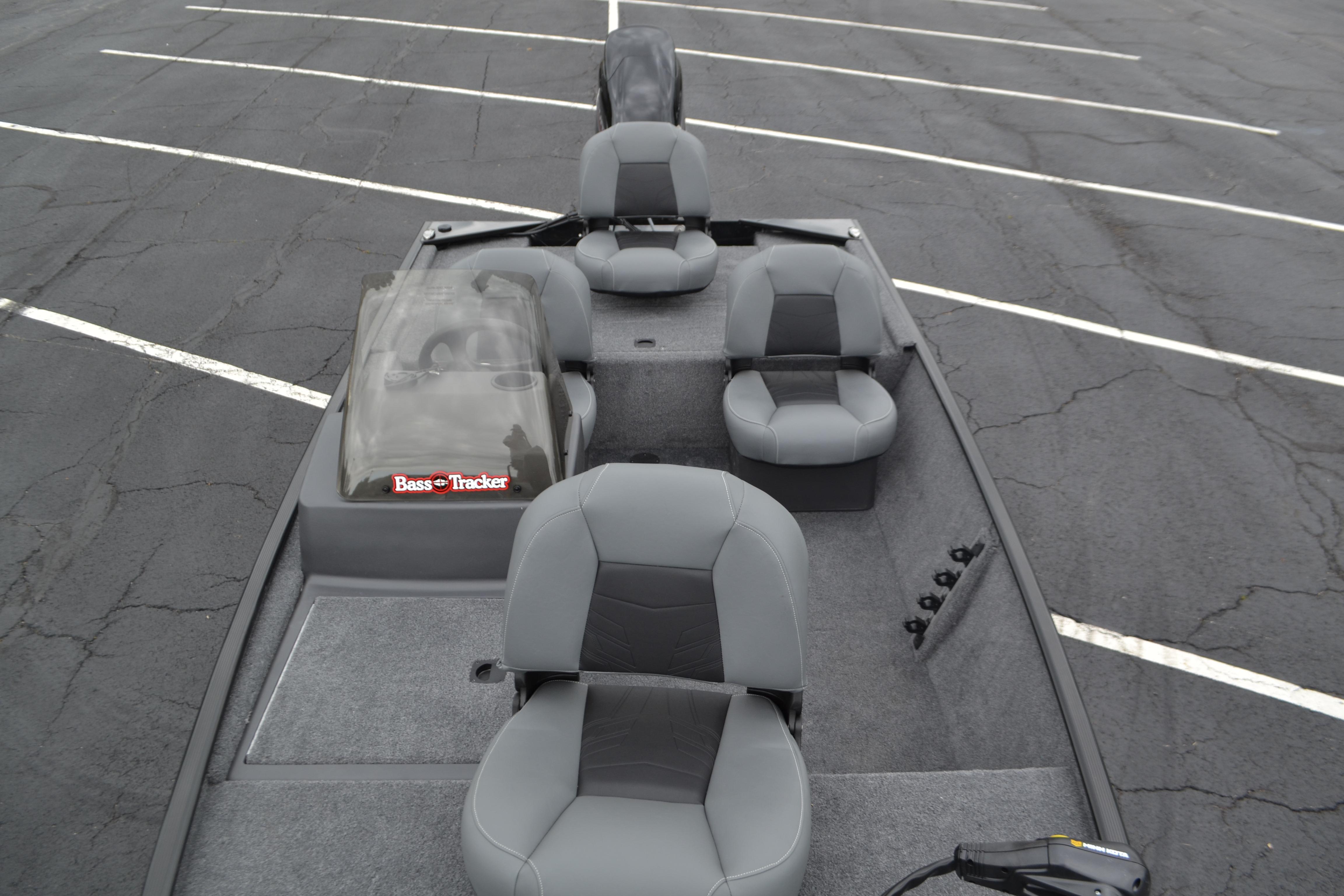 2026 Tracker Bass Tracker Classic XL boat interior with gray seating in a parking lot.