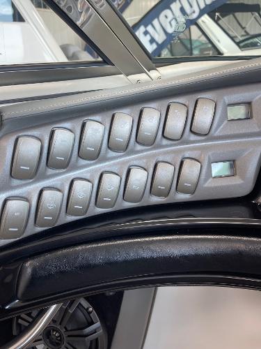 Control panel of a 2005 Cobalt 343 boat with multiple switches.