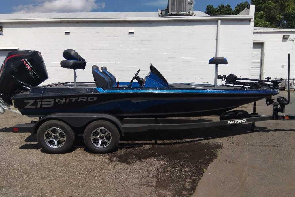 2026 Nitro Z19 XL Pro boat on trailer, parked outdoors, side view.