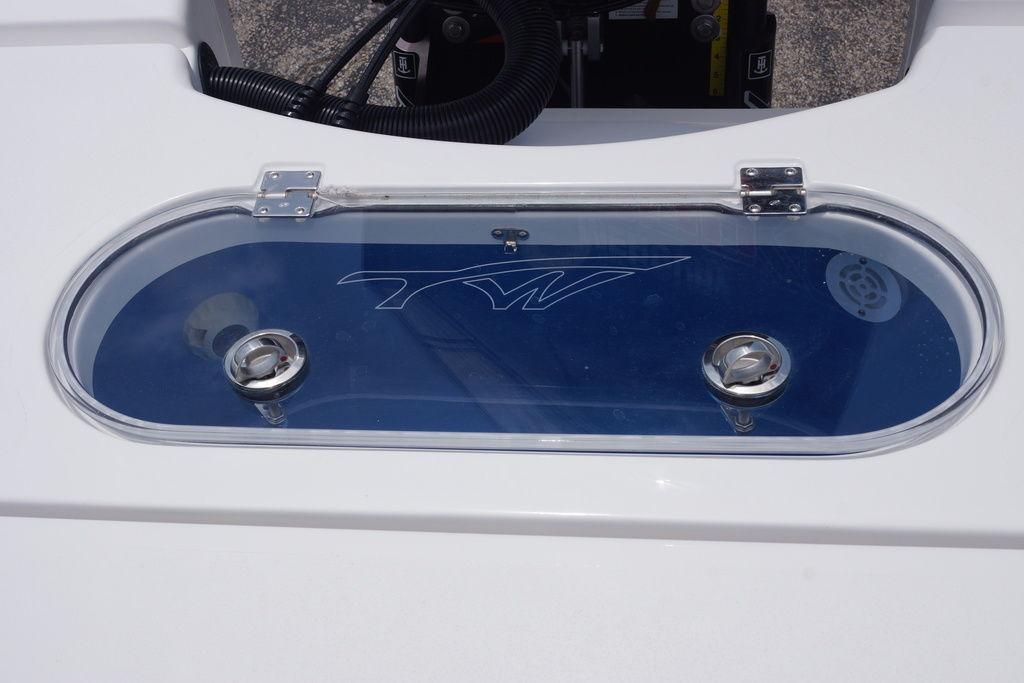 Livewell on 2027 Tidewater 2500 Carolina Bay boat, featuring a clear lid and sleek design.