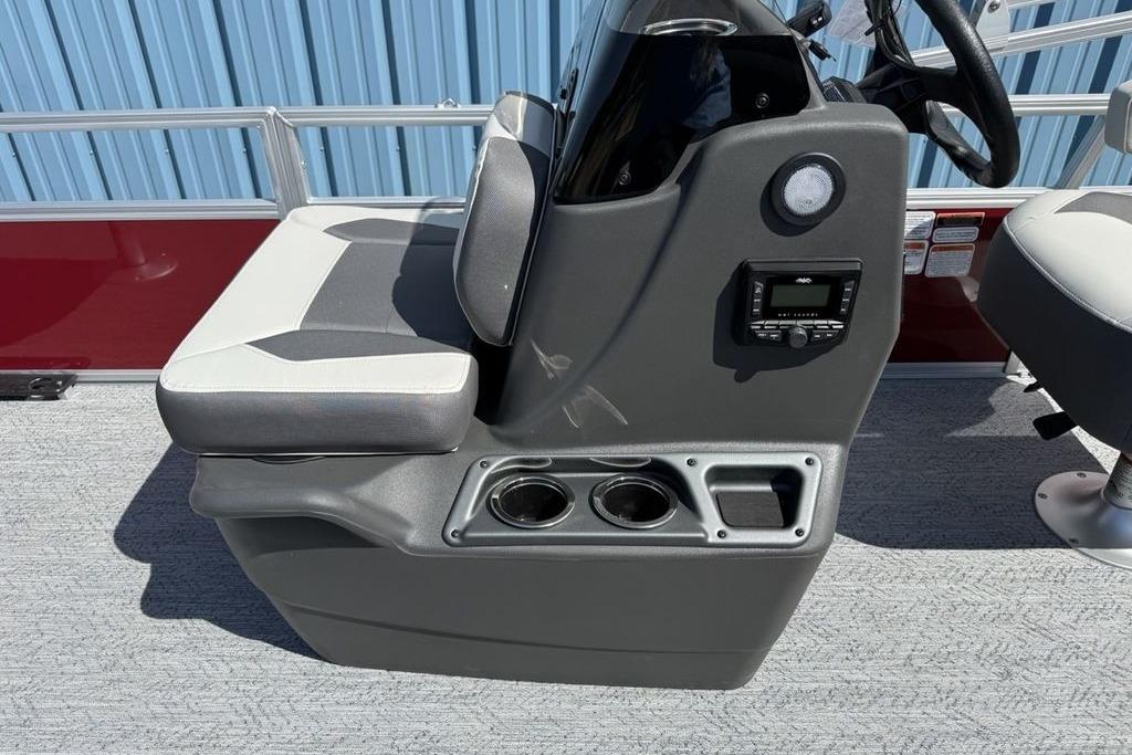 2026 Sun Tracker Bass Buggy 18 DLX boat console with seating and cup holders.