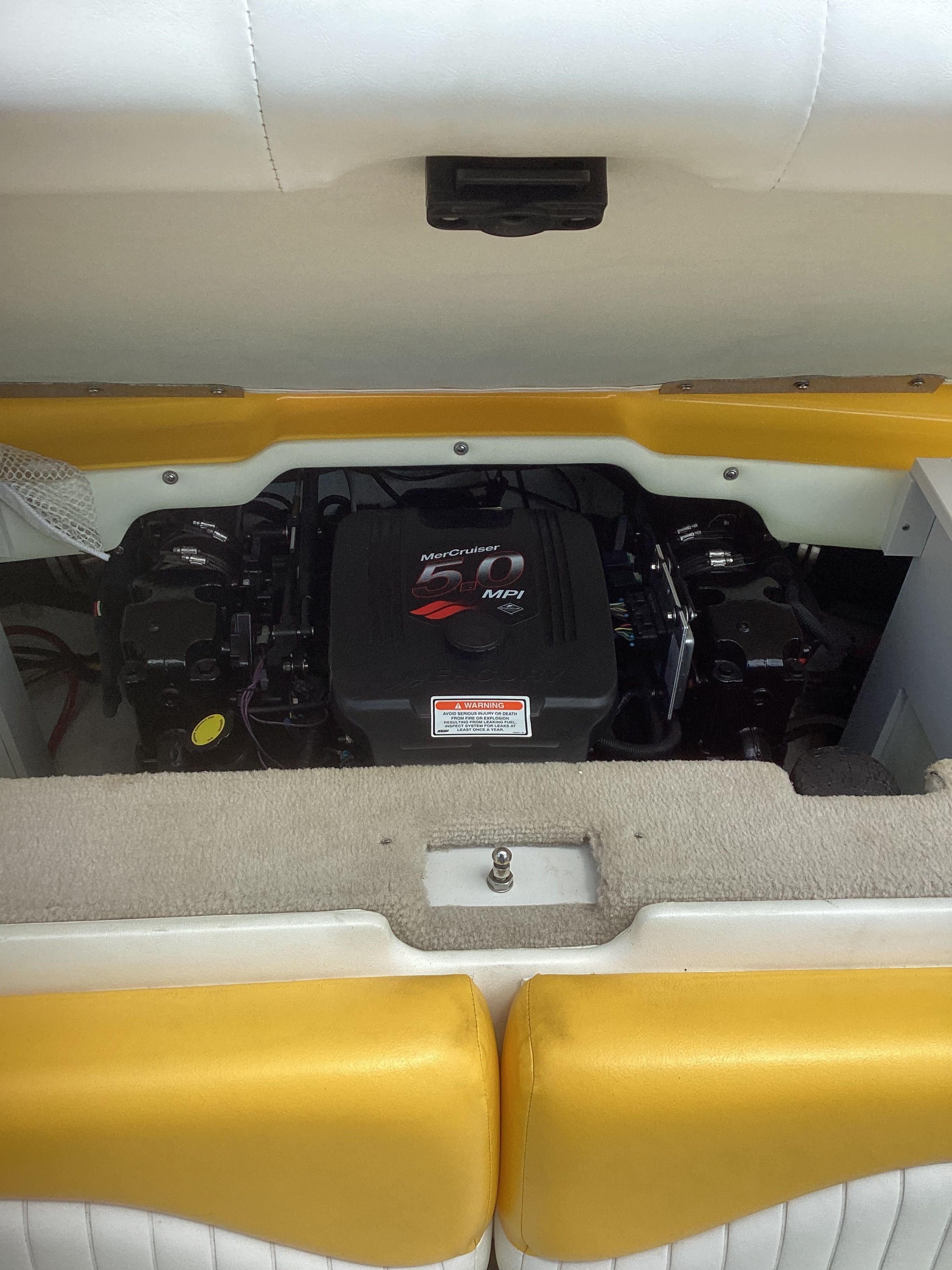 Engine compartment of a 2005 Crownline 202 BR LPX boat.