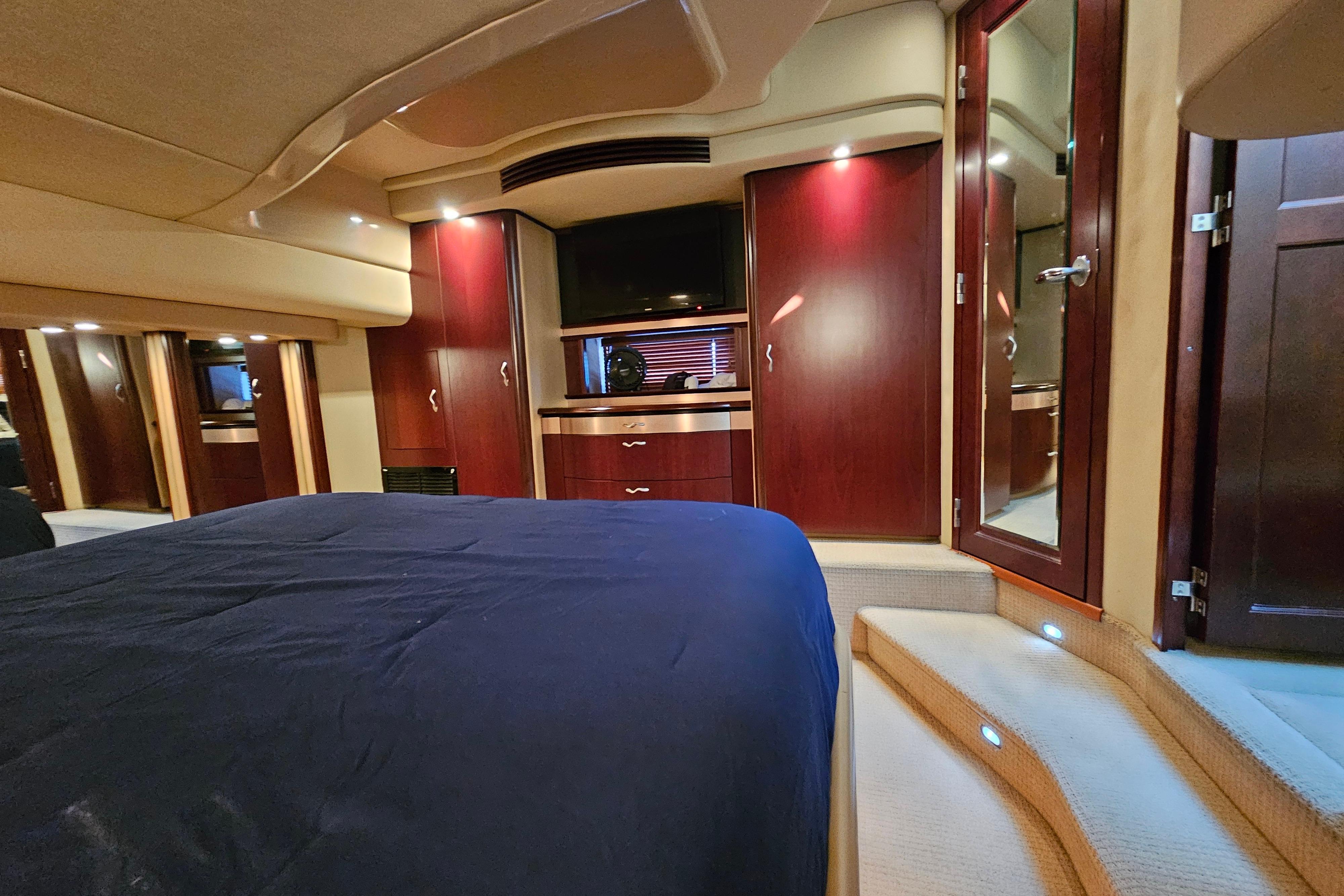 Luxurious interior of 2006 Sea Ray 580 Sedan Bridge yacht with elegant wood cabinetry.