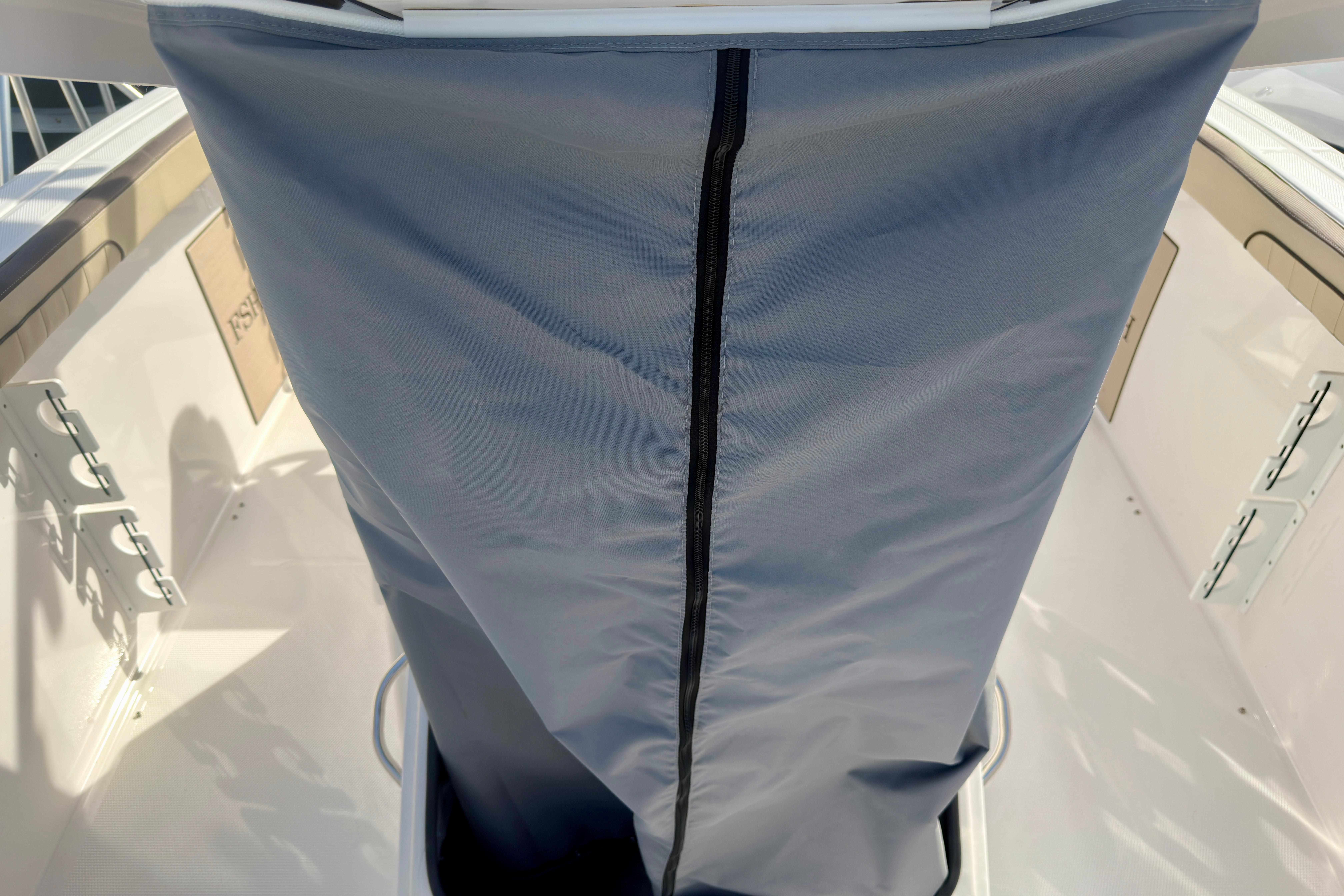 2026 Yamaha Boats 255 FSH Sport H interior with protective cover and sleek design.