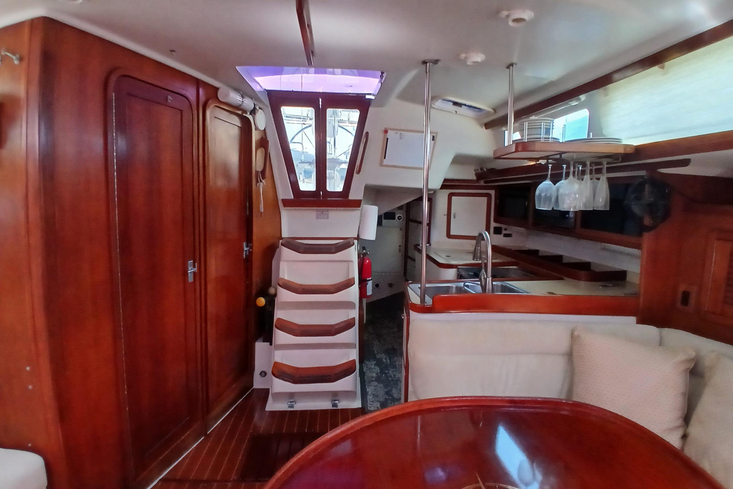 Interior of a 1995 Catalina 42 MkII sailboat with wood finishes and modern amenities.
