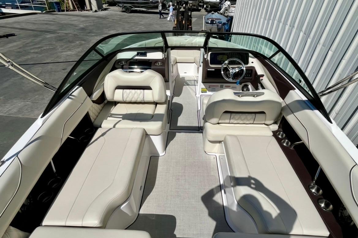 Interior view of a 2025 Regal LX2 boat with luxurious seating and modern dashboard.