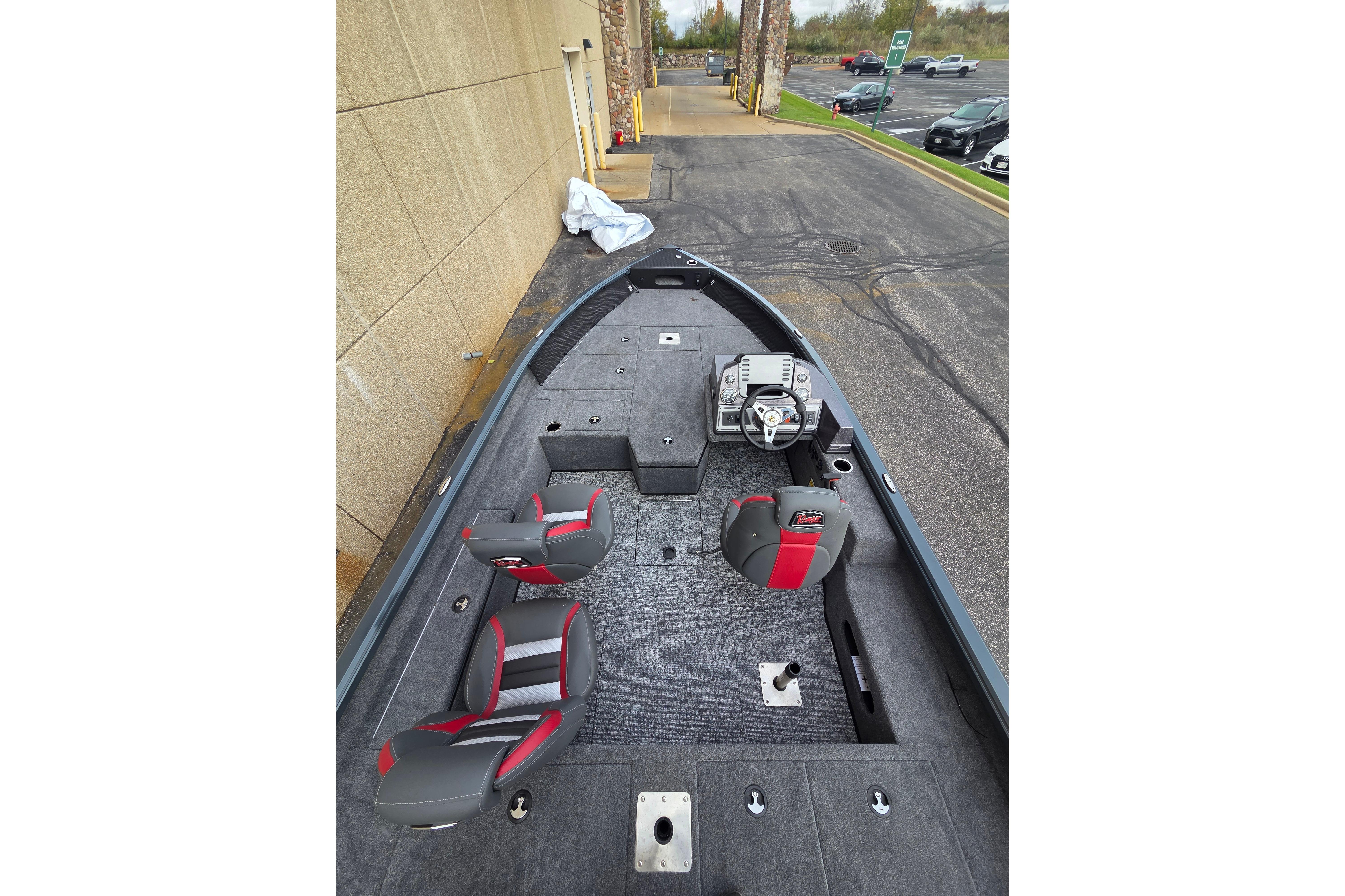 2025 Ranger VS1682SC Angler boat interior with red and gray seating, steering console, and storage compartments.
