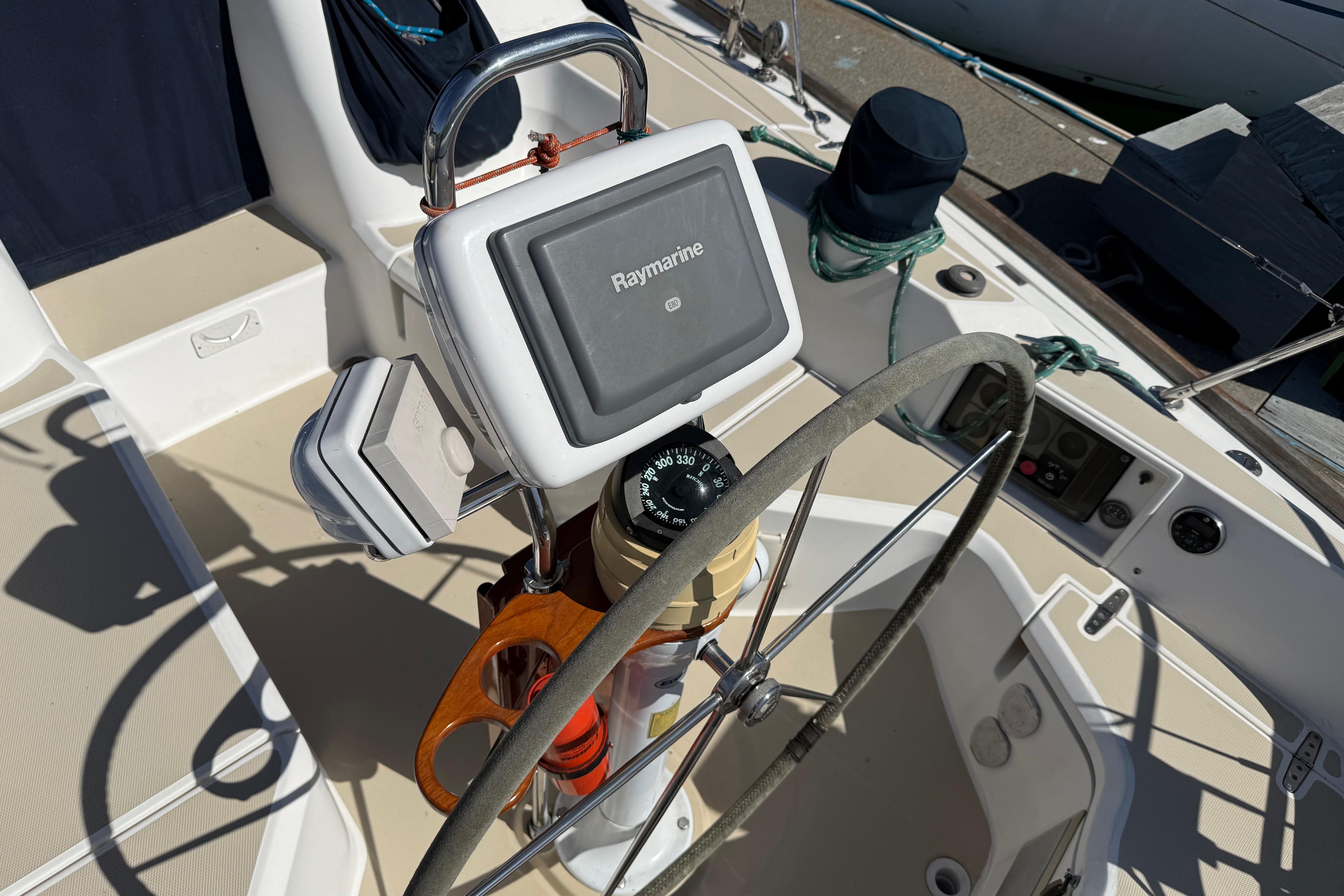 Steering wheel and navigation equipment on a 2004 Sabre 386 sailboat.