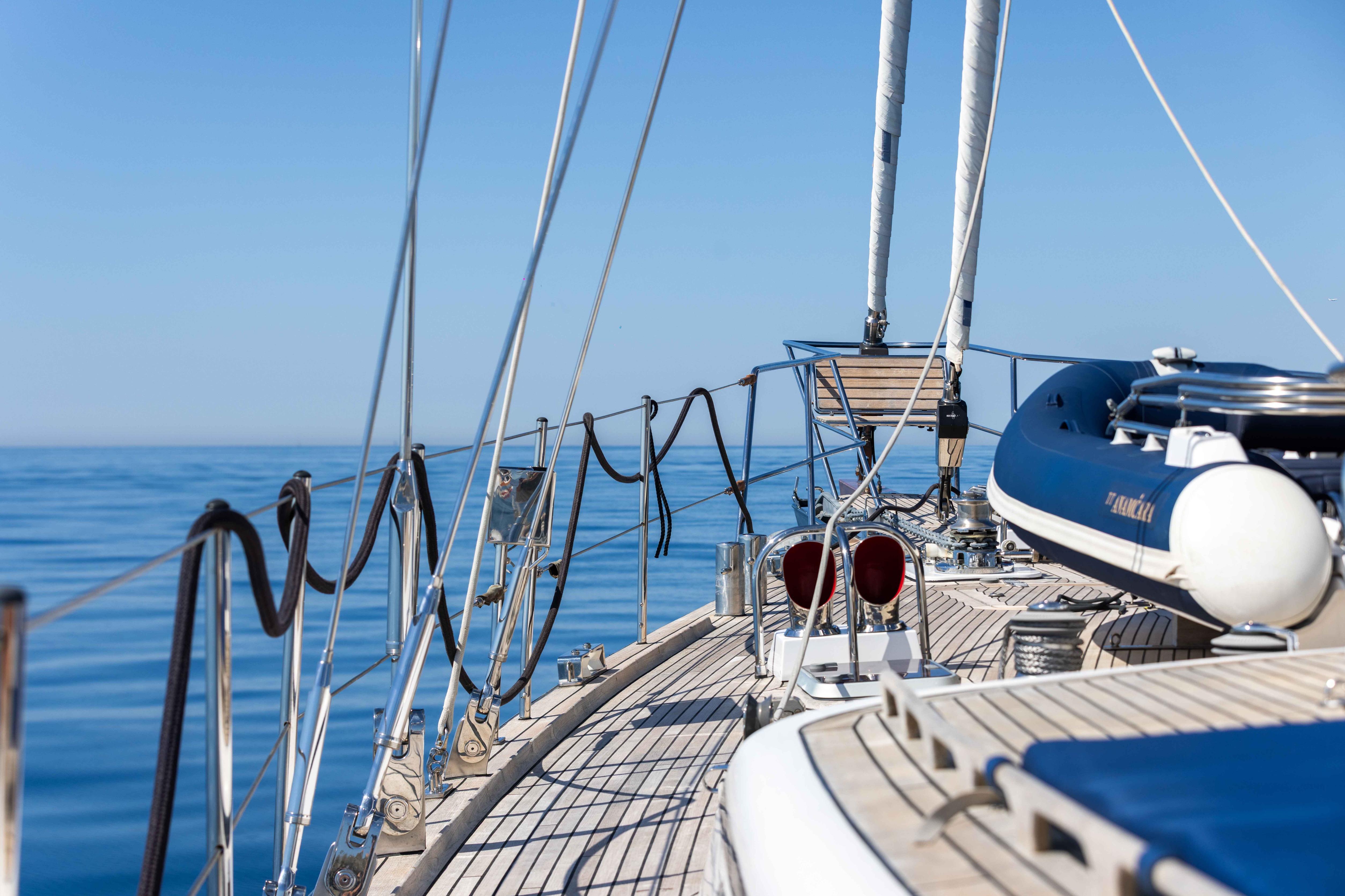 Deck view of 2001 Jongert 31 yacht sailing on calm blue sea.