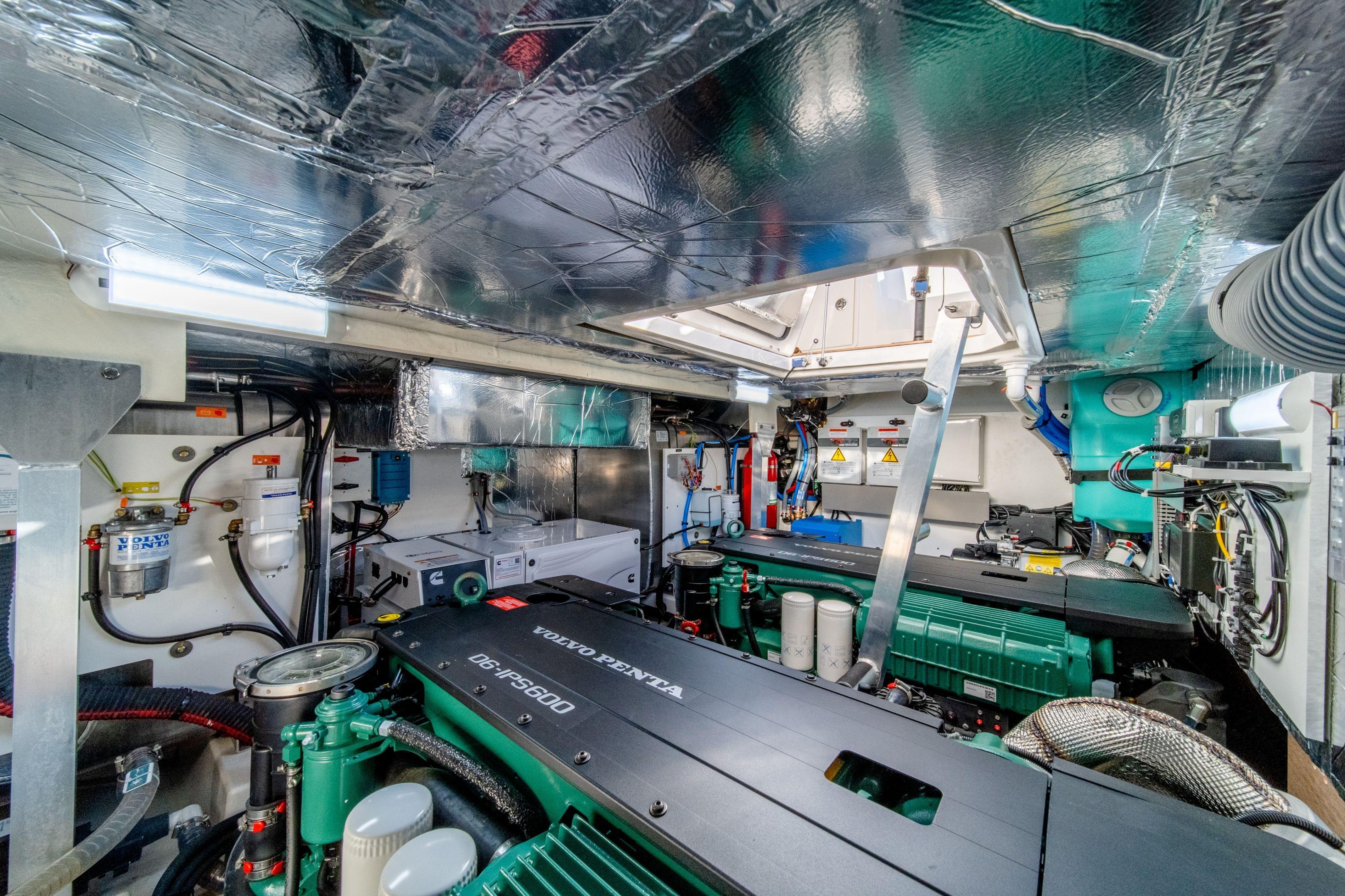 Engine room of a 2026 Prestige 460 yacht, featuring advanced mechanical systems.