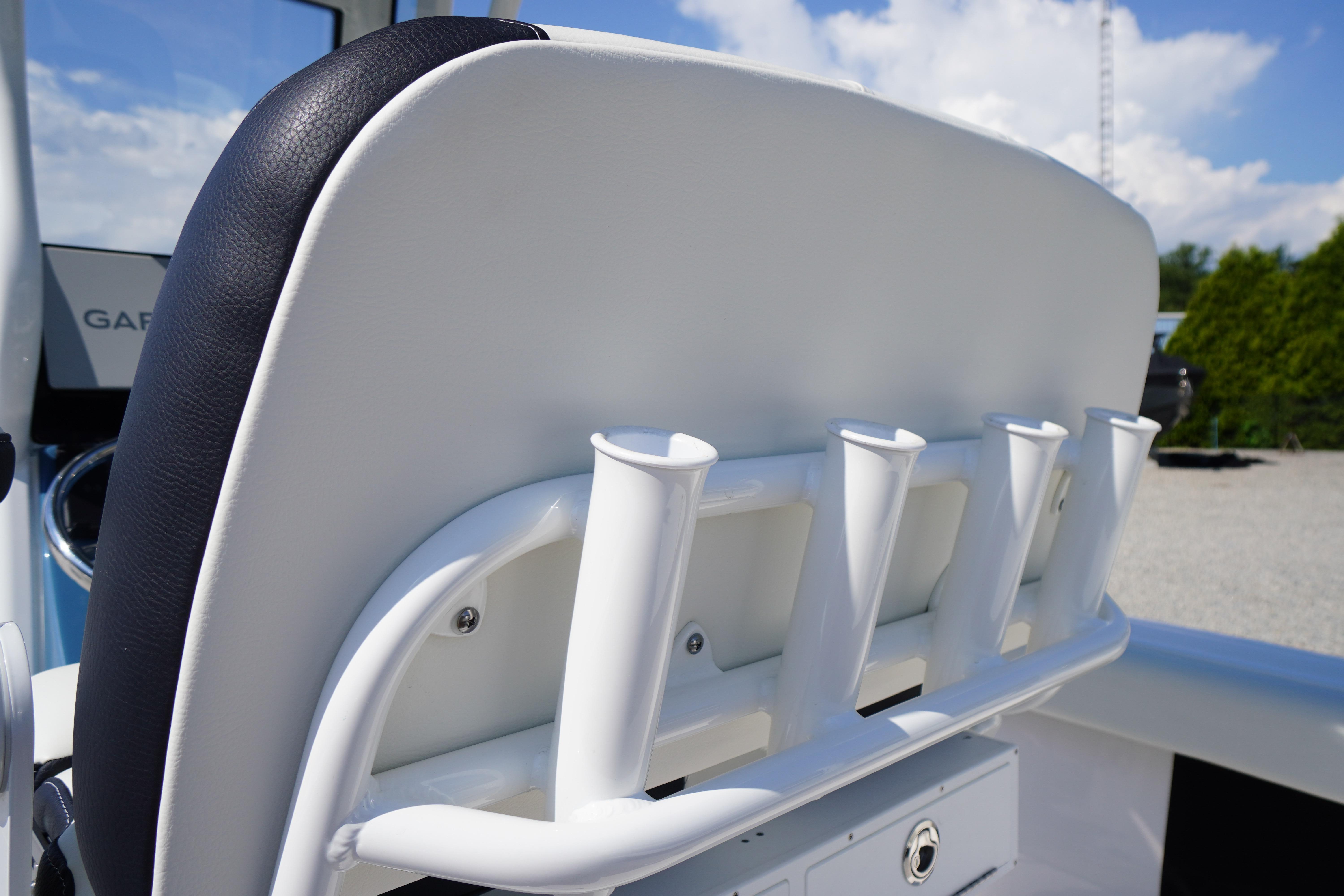 2025 Tidewater 232 SS boat seat with integrated rod holders, outdoor setting.