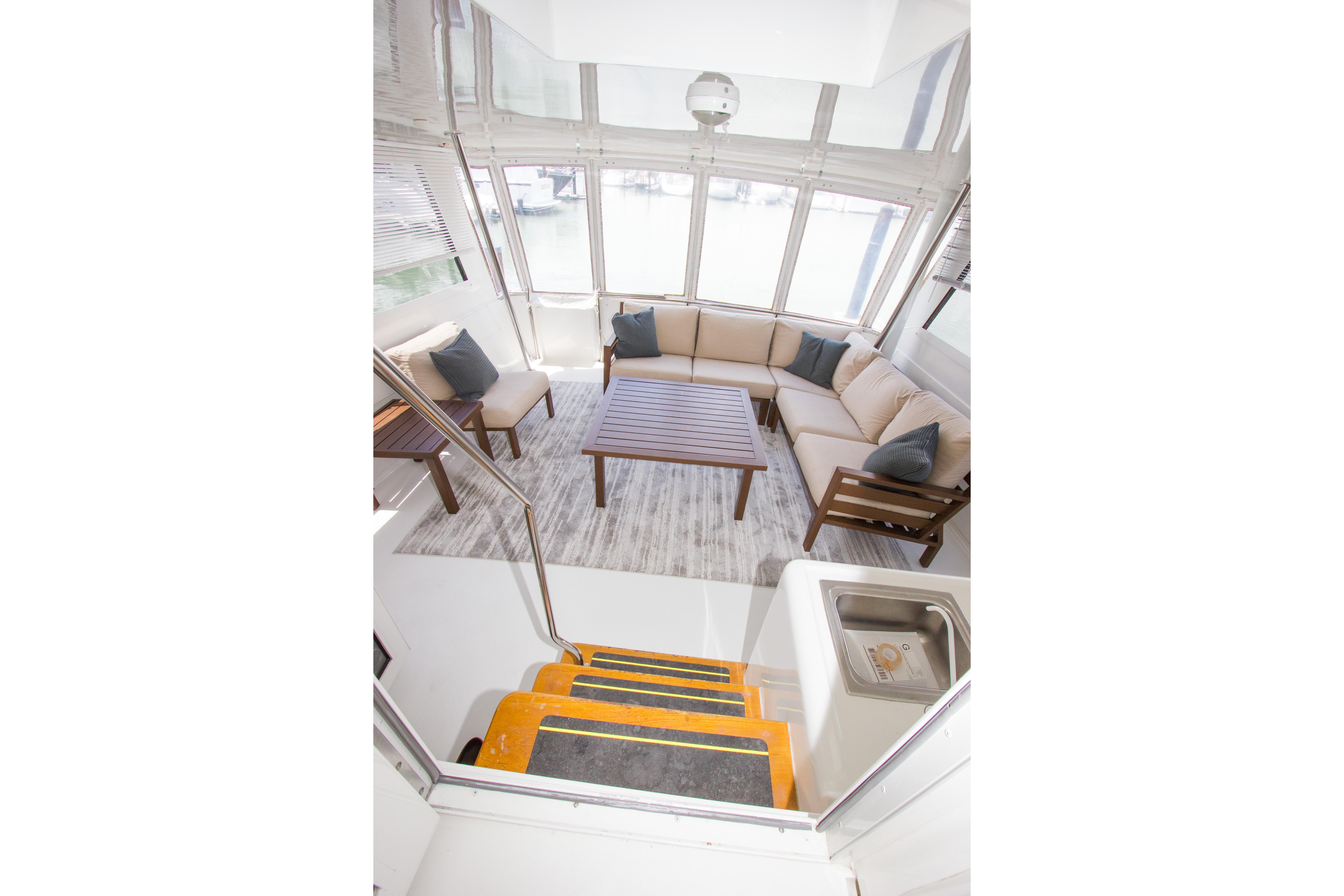 Interior of 1994 Hatteras 52 Cockpit Motor Yacht with spacious seating and modern decor.
