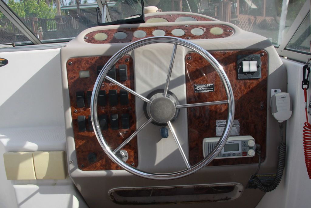 Steering console of a 1999 Maxum 2400 Mercruiser boat.