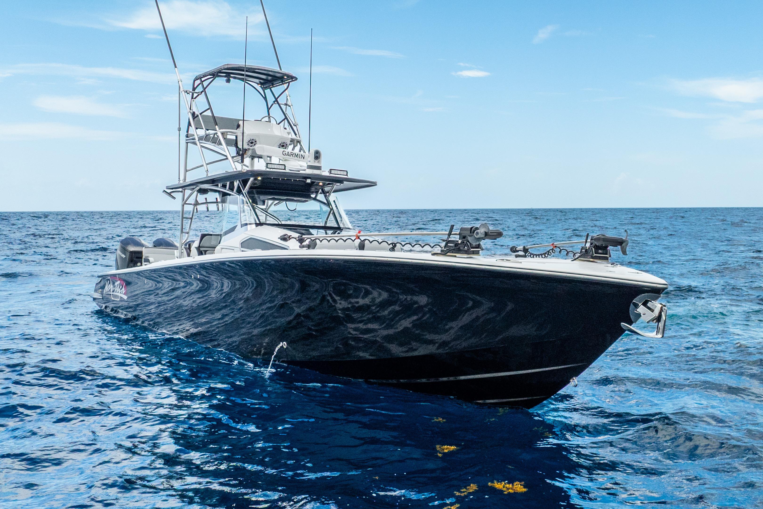 2024 Nor-Tech 452 Super Fish boat on open ocean under clear sky.