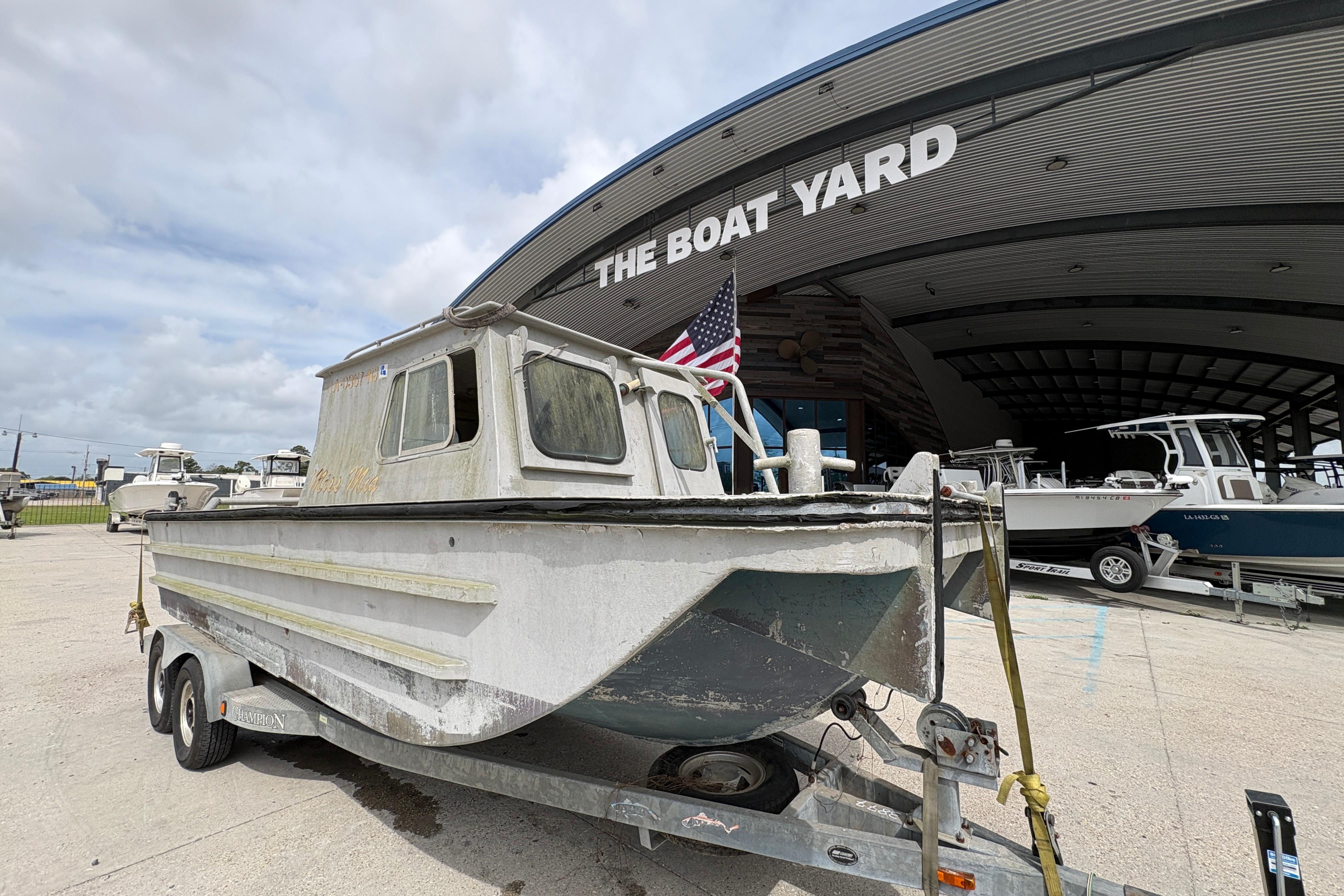 1972 Custom 23' work/push boat on trailer at The Boat Yard.